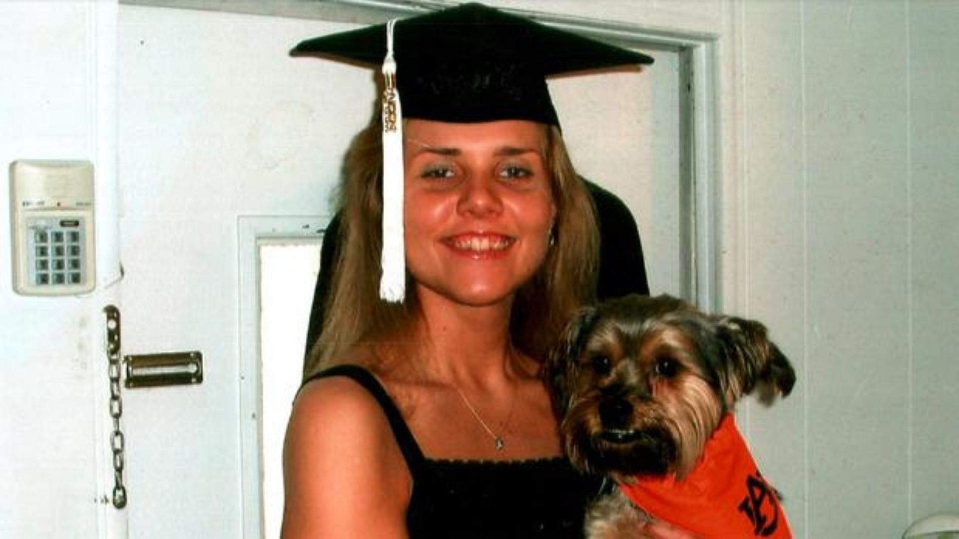 A still of Lori Ann with her pet dog Peanut (Image Via CBS News)