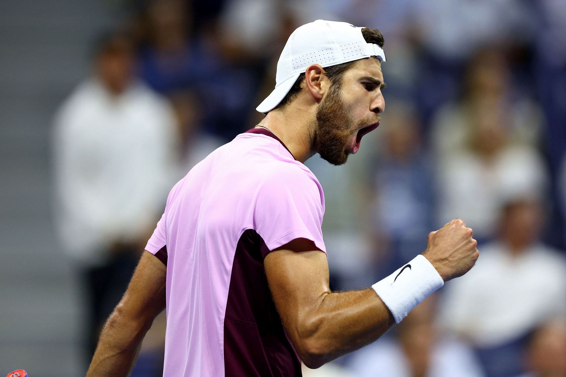 Karen Khachanov celebrates after winning a point against Nick Kyrgios.