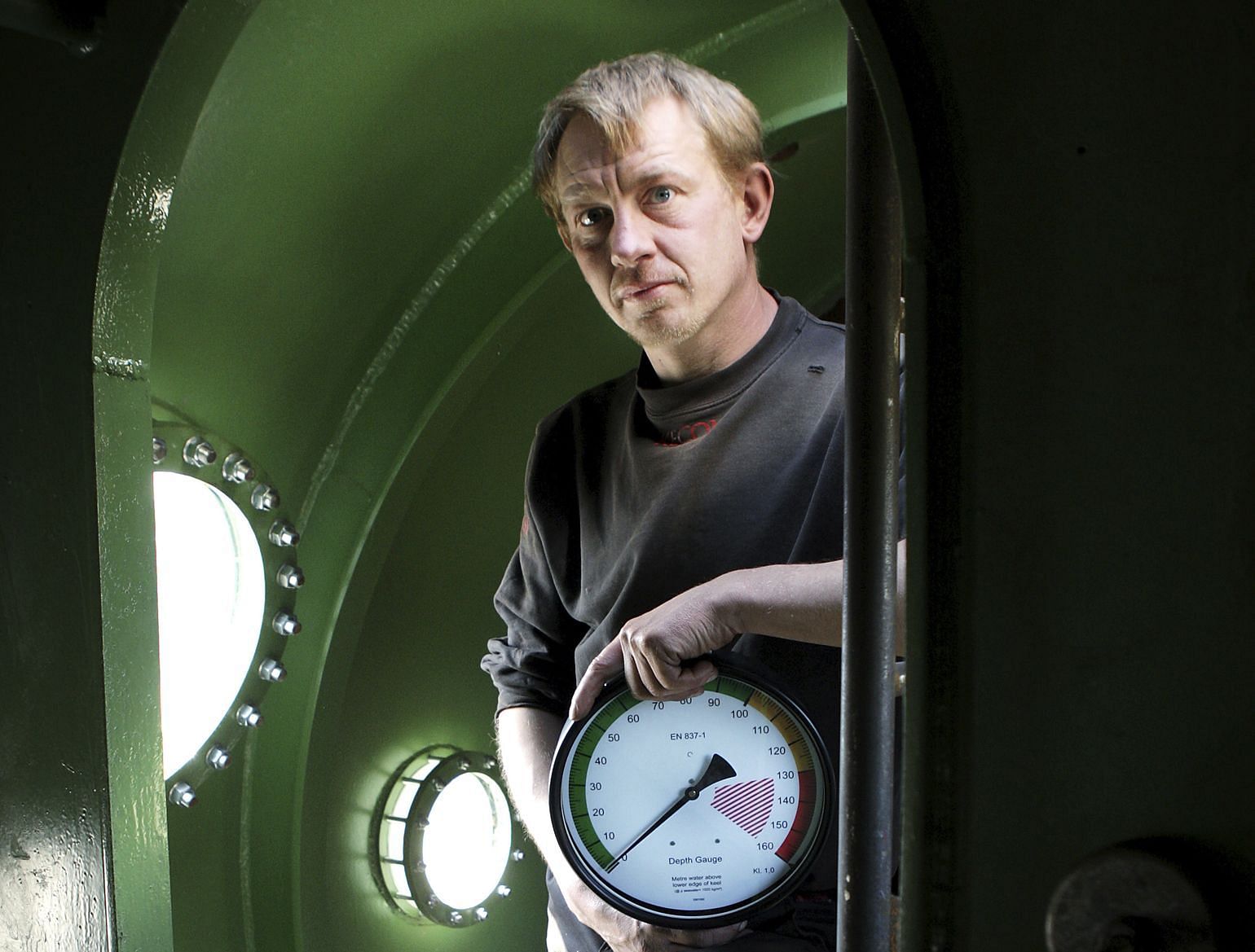 Madsen inside his submarine, UC3 Nautilus in 2008 (Image via AP Images)