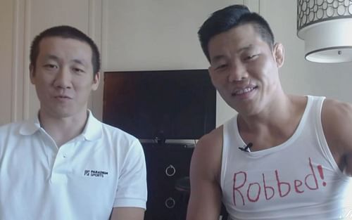 Li Jingliang with his translator [Photo credit: MMA Fighting on YouTube]