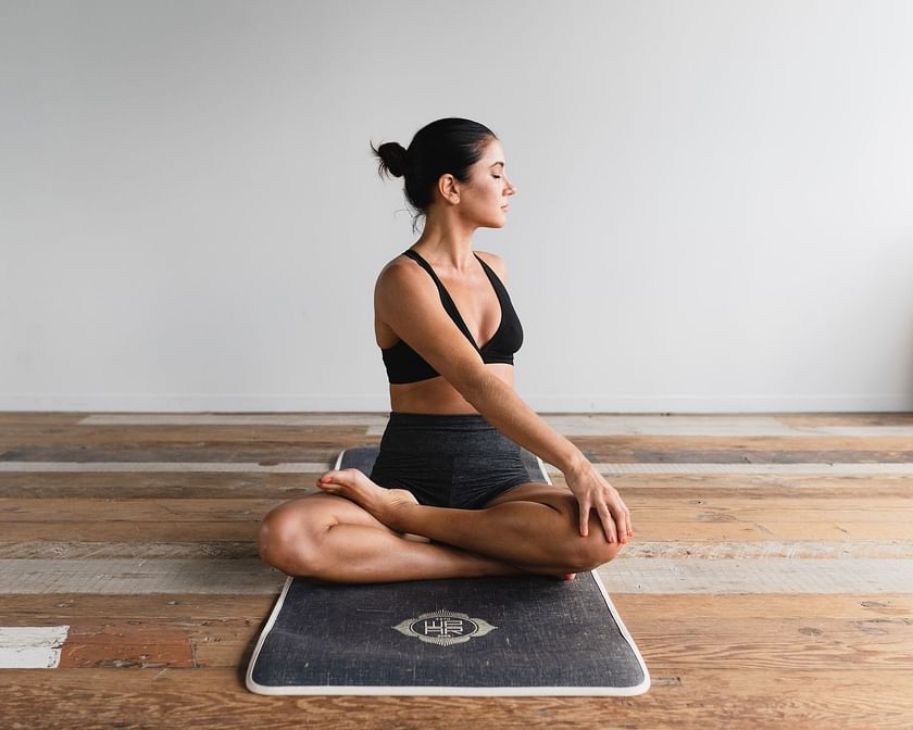 Pleasant Slim Woman Standing on the Yoga Mat Stock Photo - Image