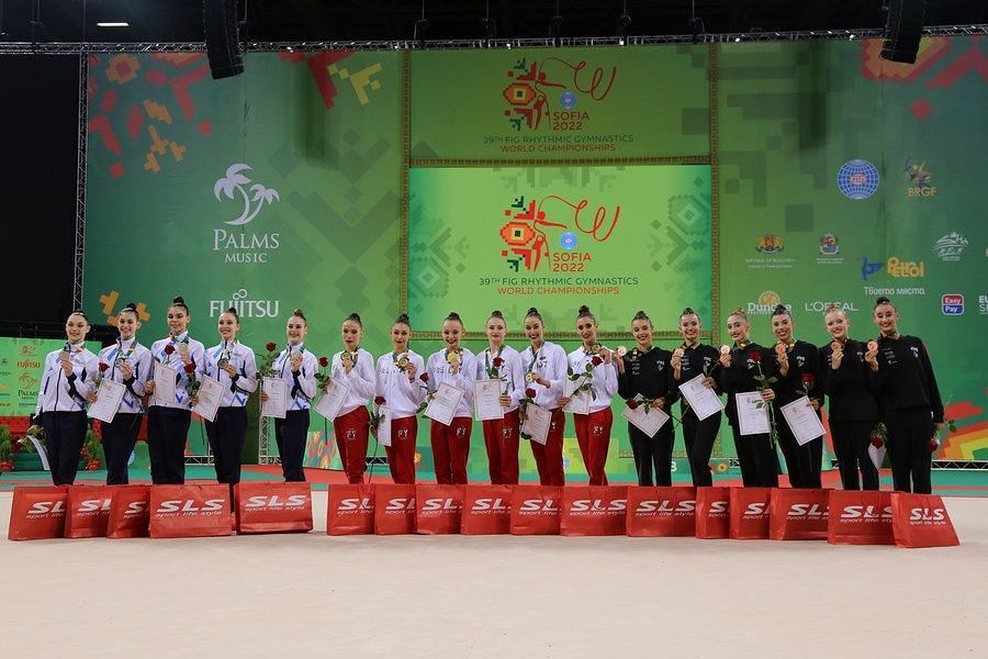 Group All-Around Medal Ceremony: from L to R: Israel with silver, Bulgaria with gold and Spain with bronze (Image via Xinhua/Lin Hao)