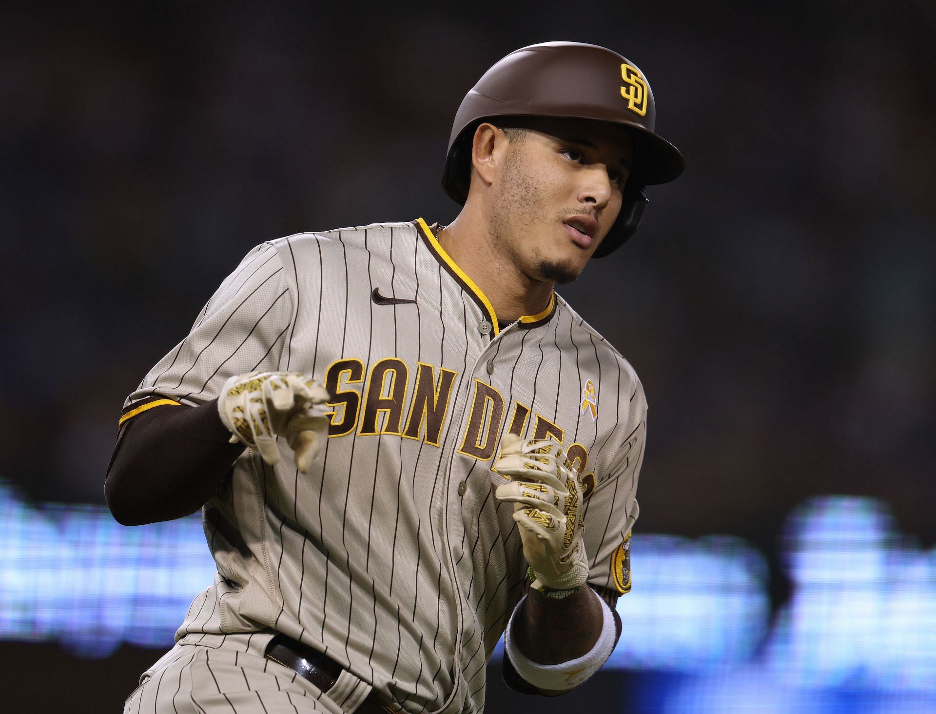 Manny Machado of the San Diego Padres rounds the bases after