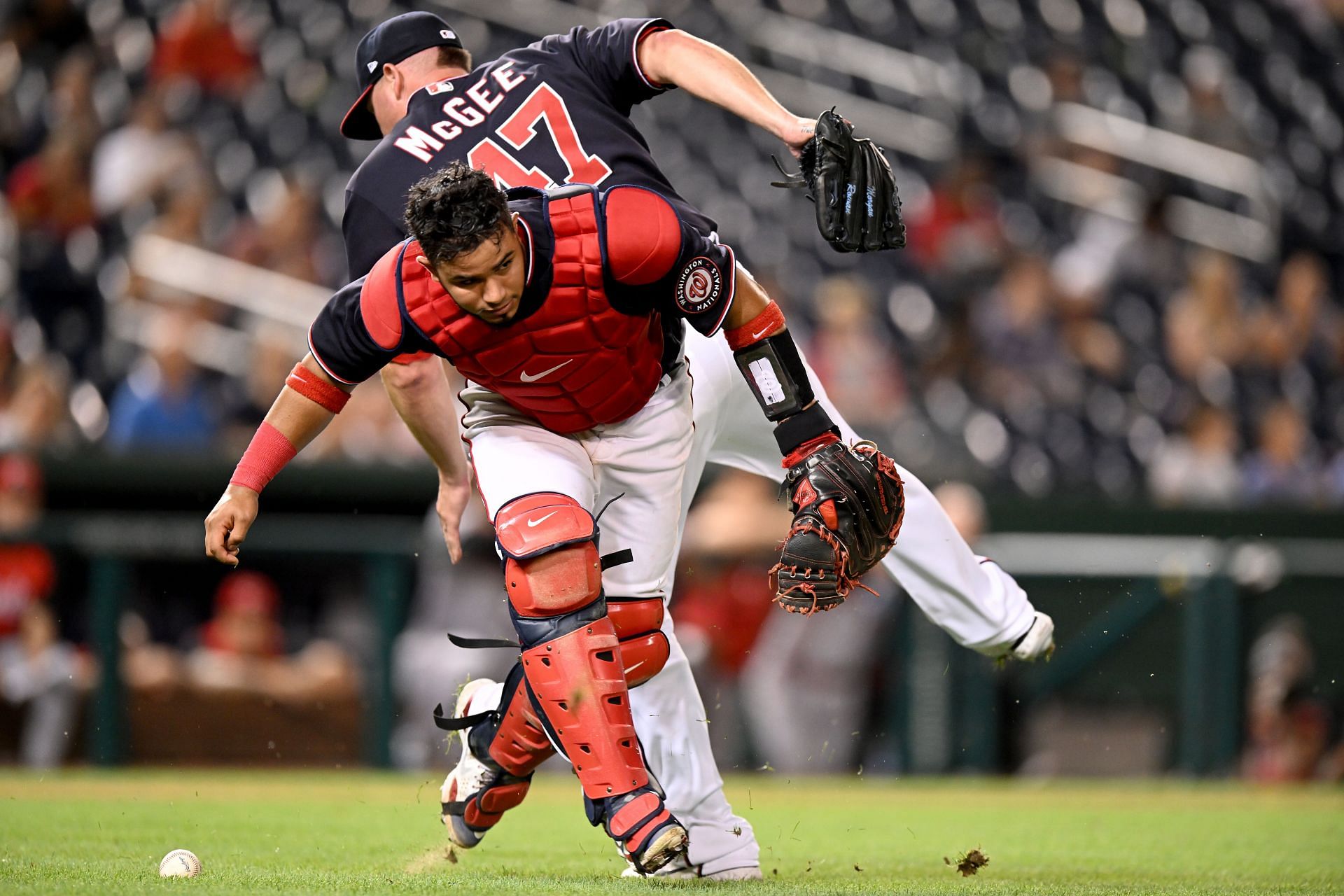 Keibert Ruiz collides with Jake McGee while trying to field a ball against the Cincinnati Reds.