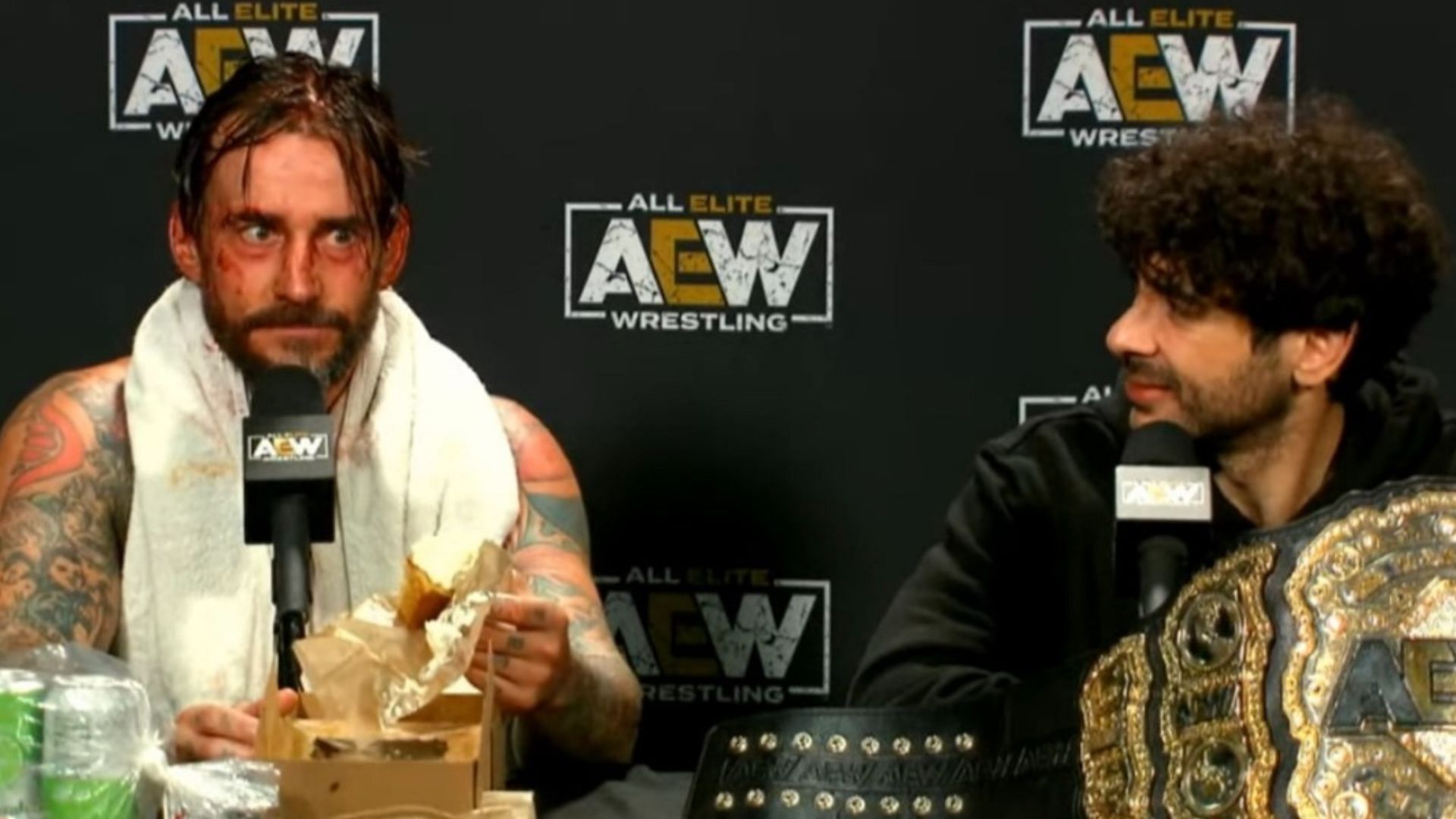 CM Punk and Tony Khan at the AEW All Out 2022 media scrum 