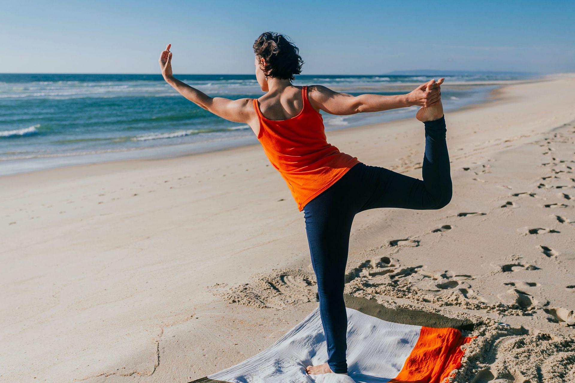 Yoga helps improve your mental health and boosts brain health. (Image via Unsplash /Julia Sakalouskaya)