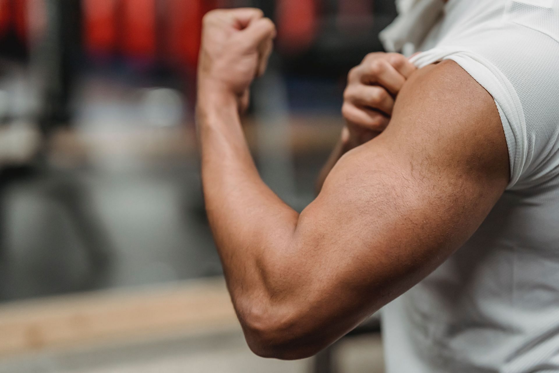 Strong arms are extremely important for daily functions like lifting (Image via Pexels @Julia Larson)