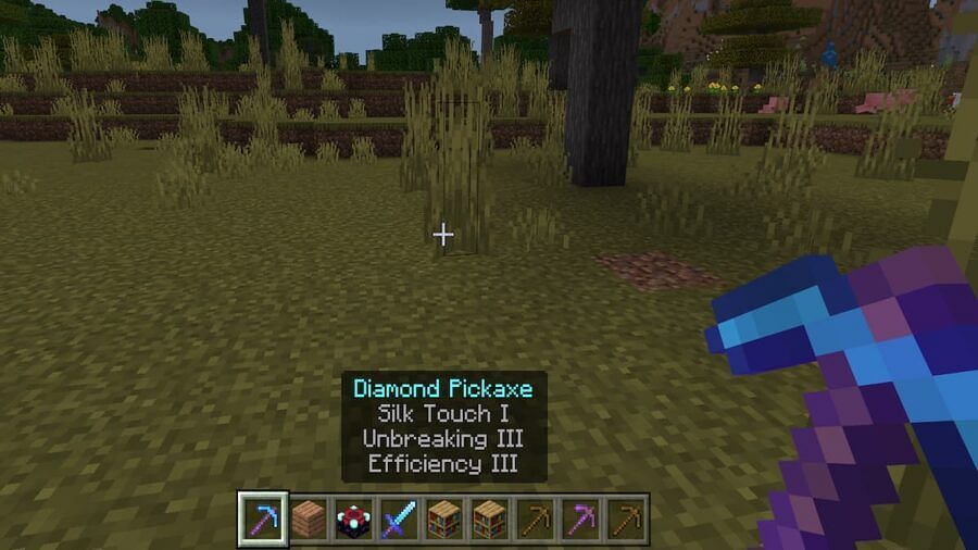 Silk Touch can go on pickaxes and axes (Image via Mojang)