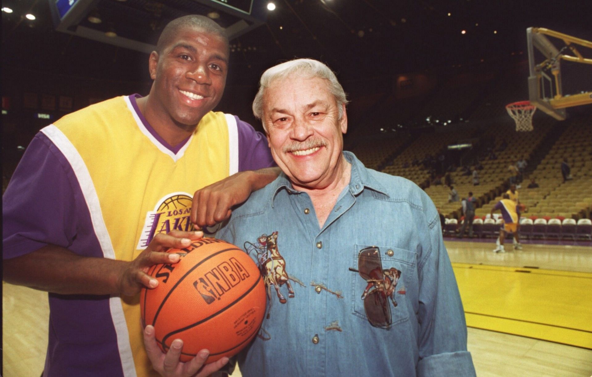 Former LA Lakers superstar Magic Johnson and the late Dr. Jerry Buss