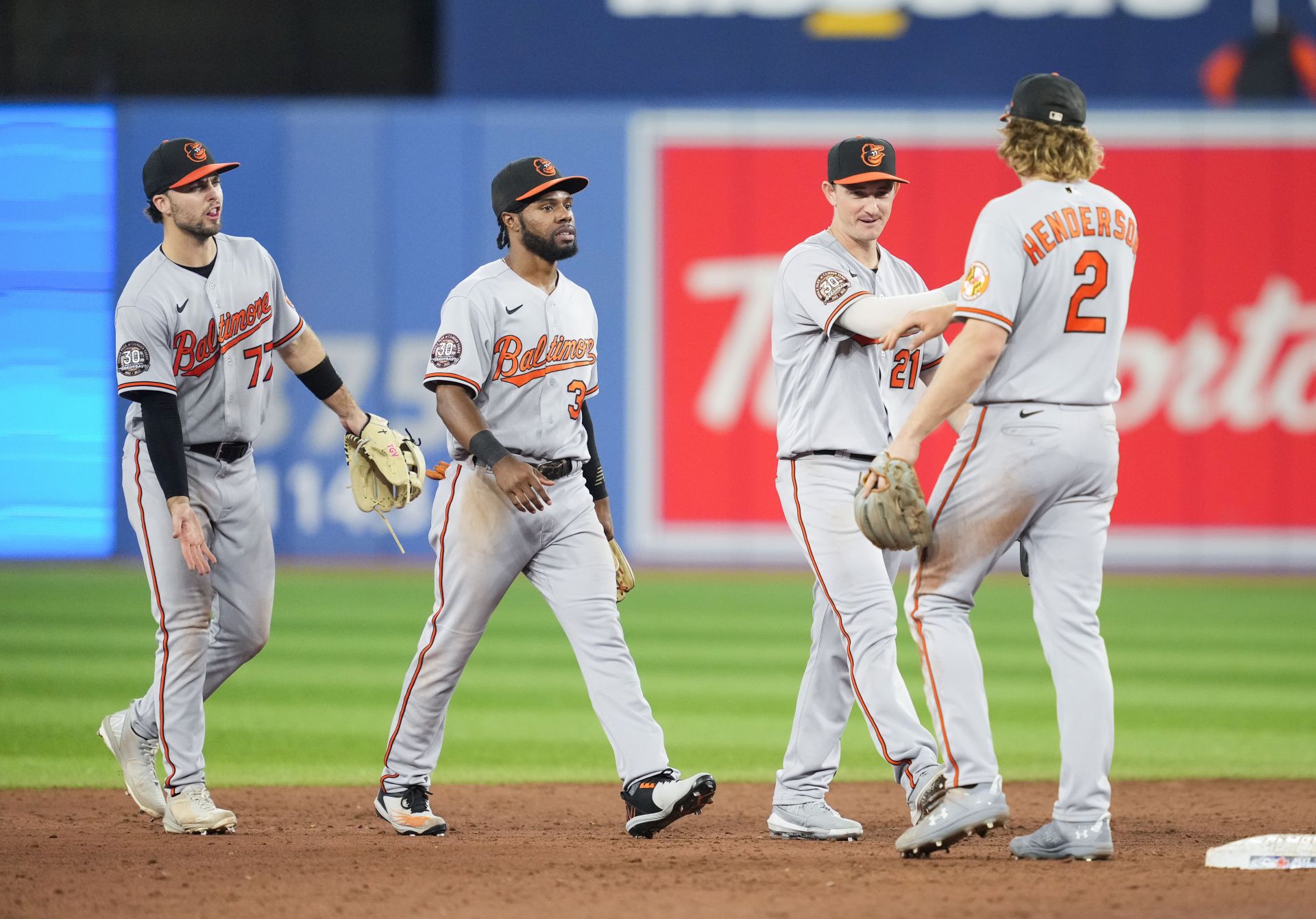 Gunnar Henderson, Jose Hernandez, Cedric Mullins and Terrin Vavra celebrate a win over the Toronto Blue Jays