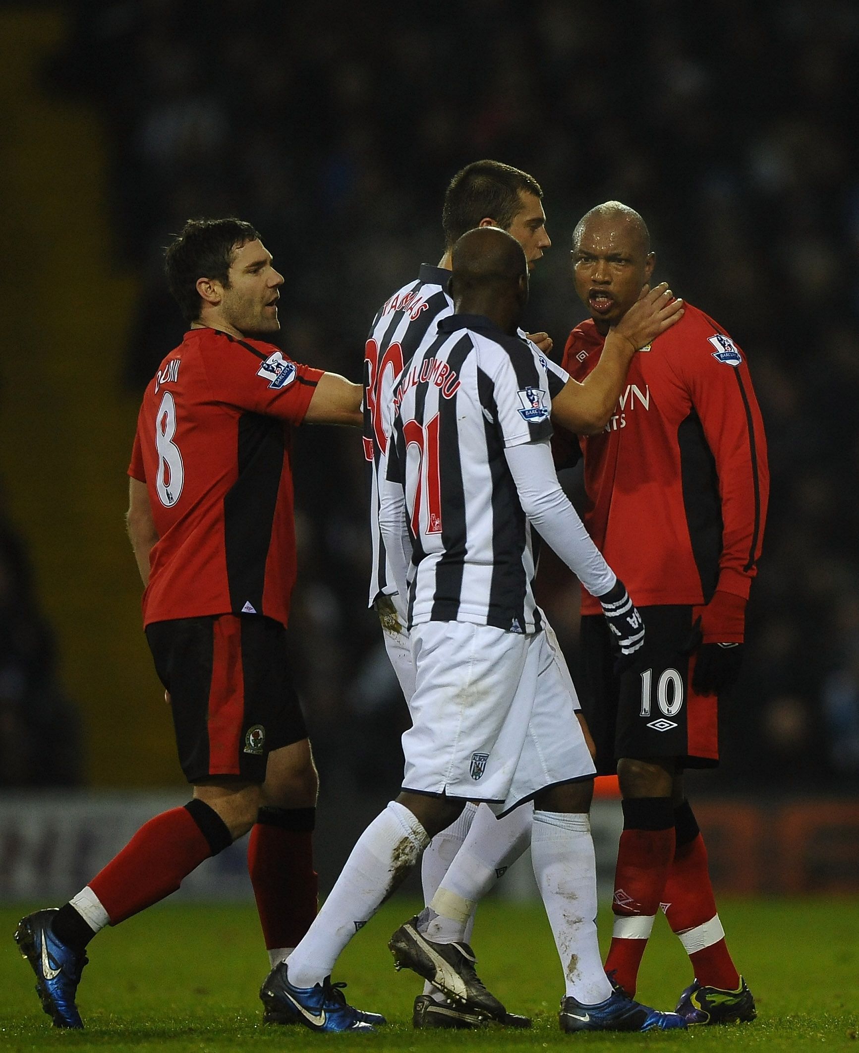 El-Hadji Diouf of Blackburn Rovers argues with Youssouf Mulumbu of West Bromwich Albion during the Barclays Premier League match between West Bromwich Albion and Blackburn Rovers at The Hawthorns on December 28, 2010.