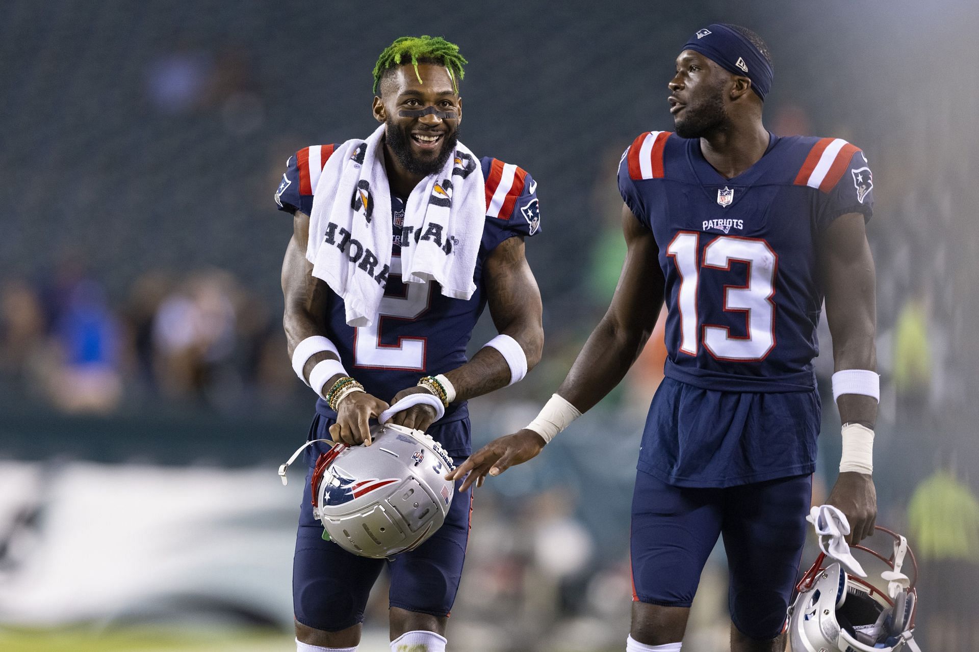 Jalen Mills (No. 2) and Nelson Agholor (No. 13) converse