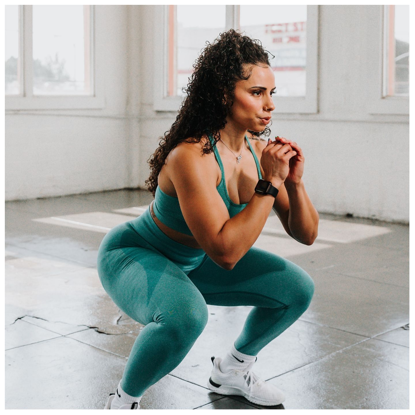 Squats and other form of bodyweight exercises can help tone your thighs and butt. (Image via Unsplash / SUNDAY II SUNDAY)