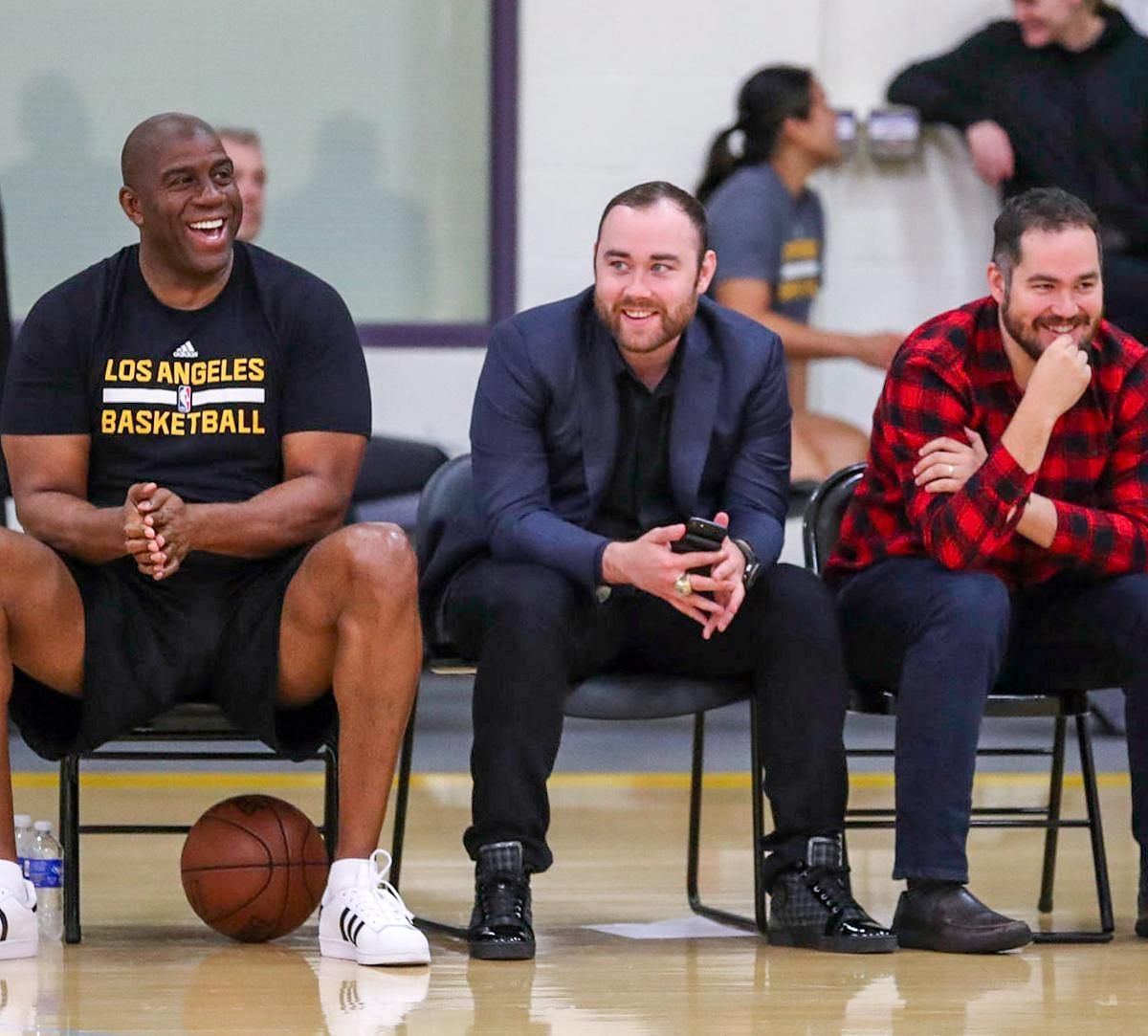 Magic Johnson (left) and Jesse Buss (center) of the LA Lakers. (Photo: Bleacher Report) 