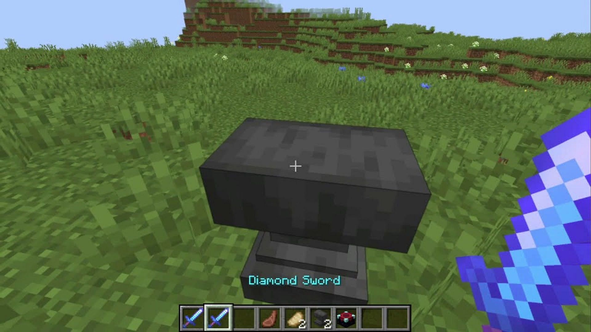 A player enchants their diamond sword at an anvil in Minecraft (Image via Crazy Karan/YouTube)