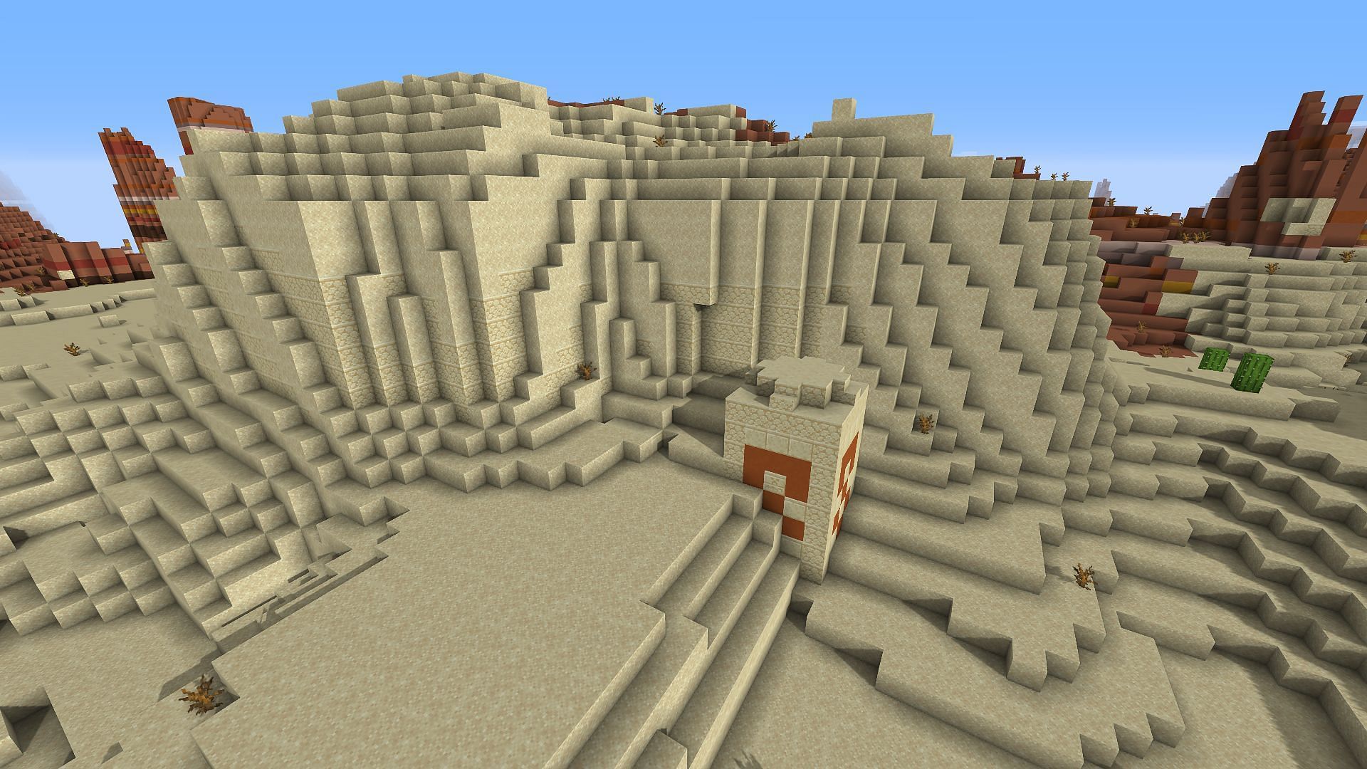 The mostly buried Desert Temple found on the seed near spawn (Image via Minecraft/Mojang)