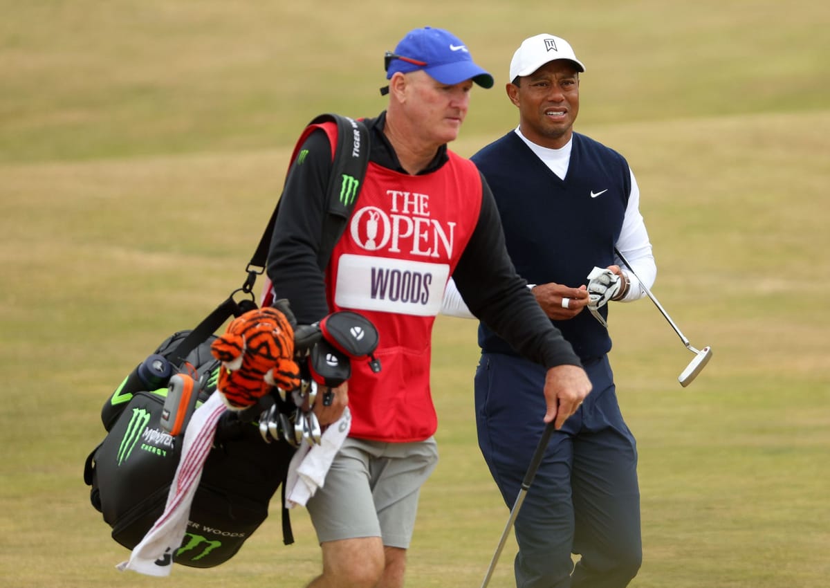 How many different caddies has Tiger Woods had?