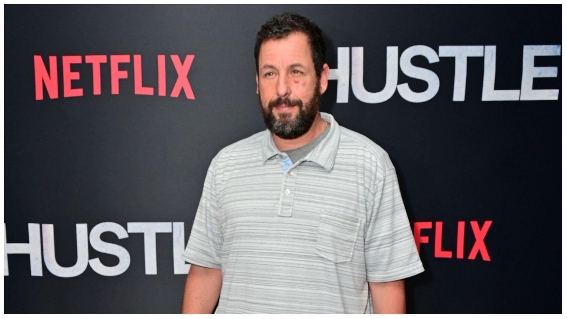 Adam Sandler was spotted walking with a cane (Image via Lisa Lake/Getty Images)