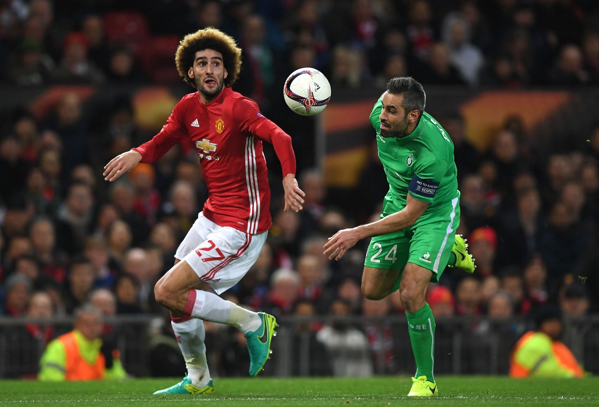 Marouane Fellaini and Loic Perrin (right) fight for the ball