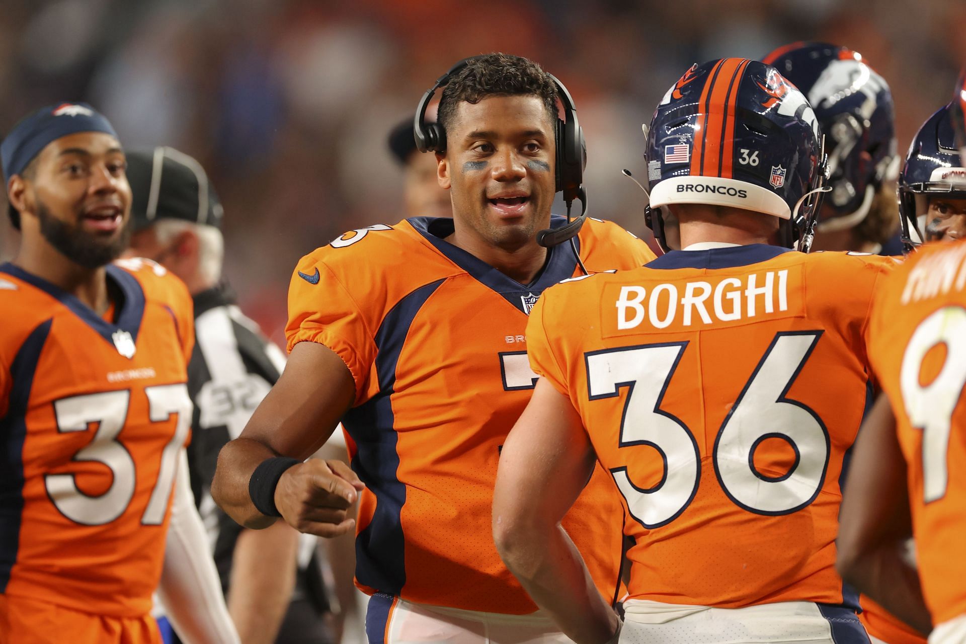 Broncos Russell Wilson greets some Seahawks, 1st fans in boo