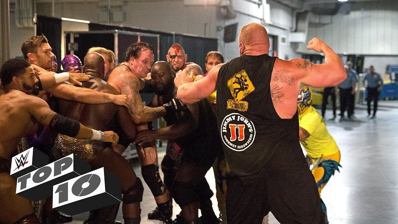 Brock Lesnar and The Undertaker fighting backstage during an episode of WWE Monday Night Raw