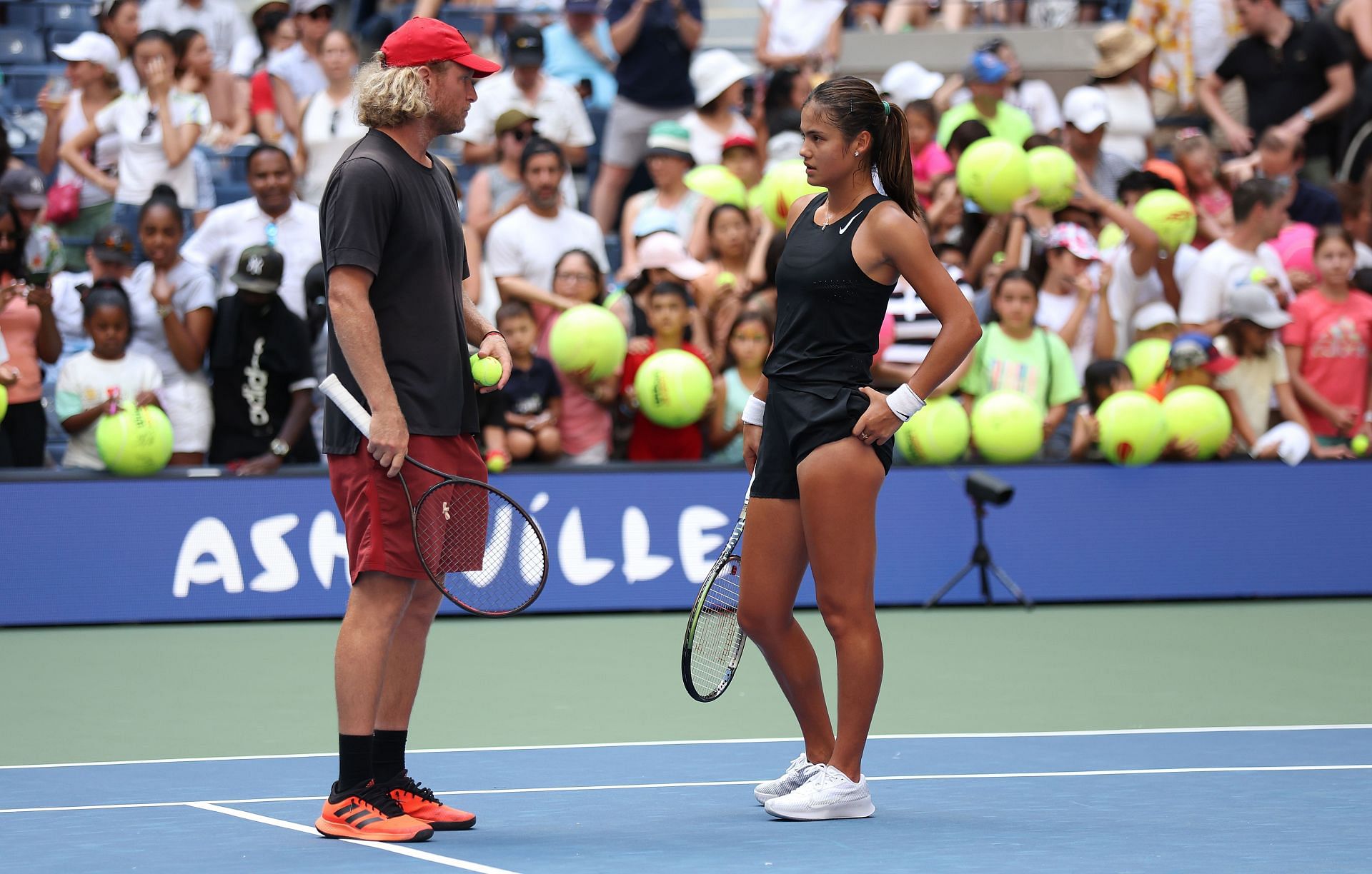 Emma Raducanu and Dmitry Tursunov during the 2022 US Open