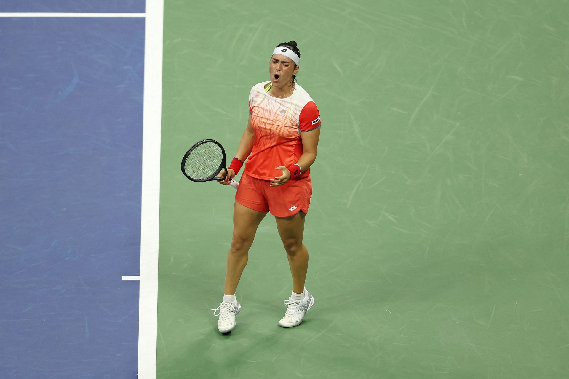 Ons Jabeur of Tunisia reacts against Veronika Kudermetova at the 2022 US Open - Day 7