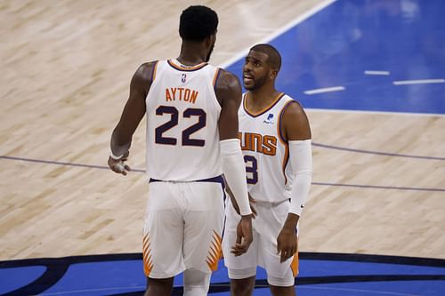 Chris Paul of the Phoenix Suns talks with Deandre Ayton