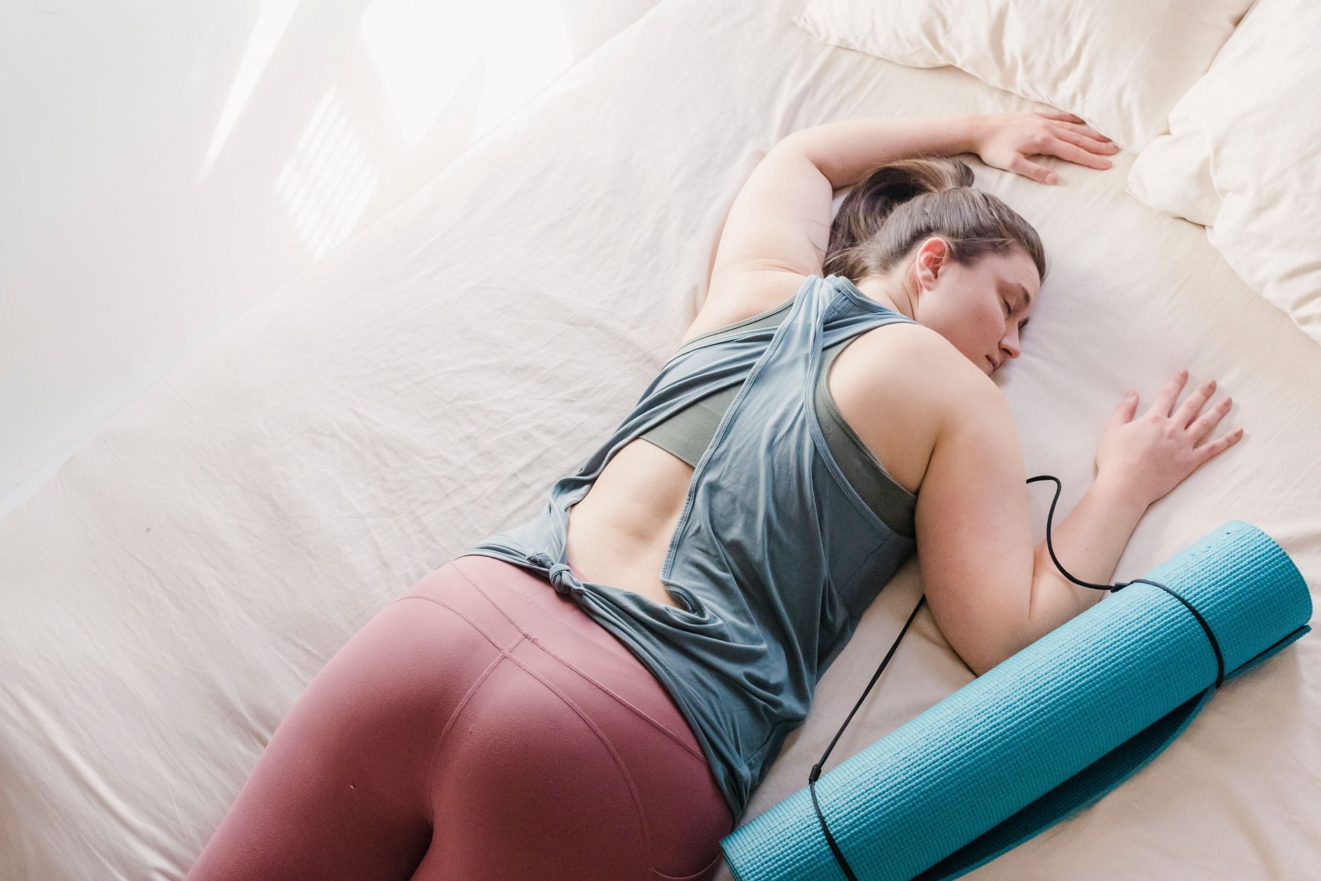 Yoga can help you calm down before sleep (Image via Pexels @Tim Samuel)