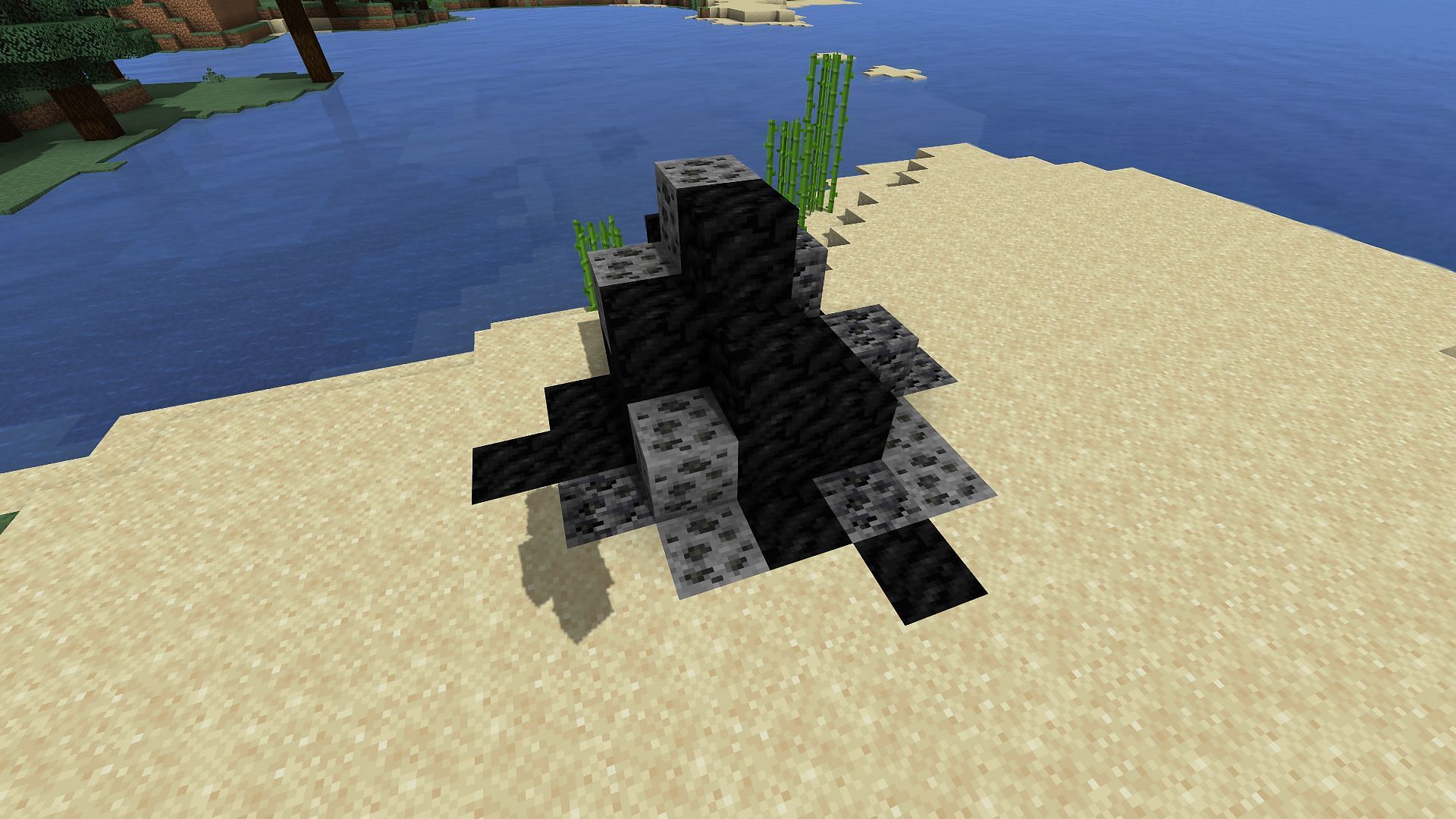 Different coal ores and blocks of coal (Image via Minecraft)