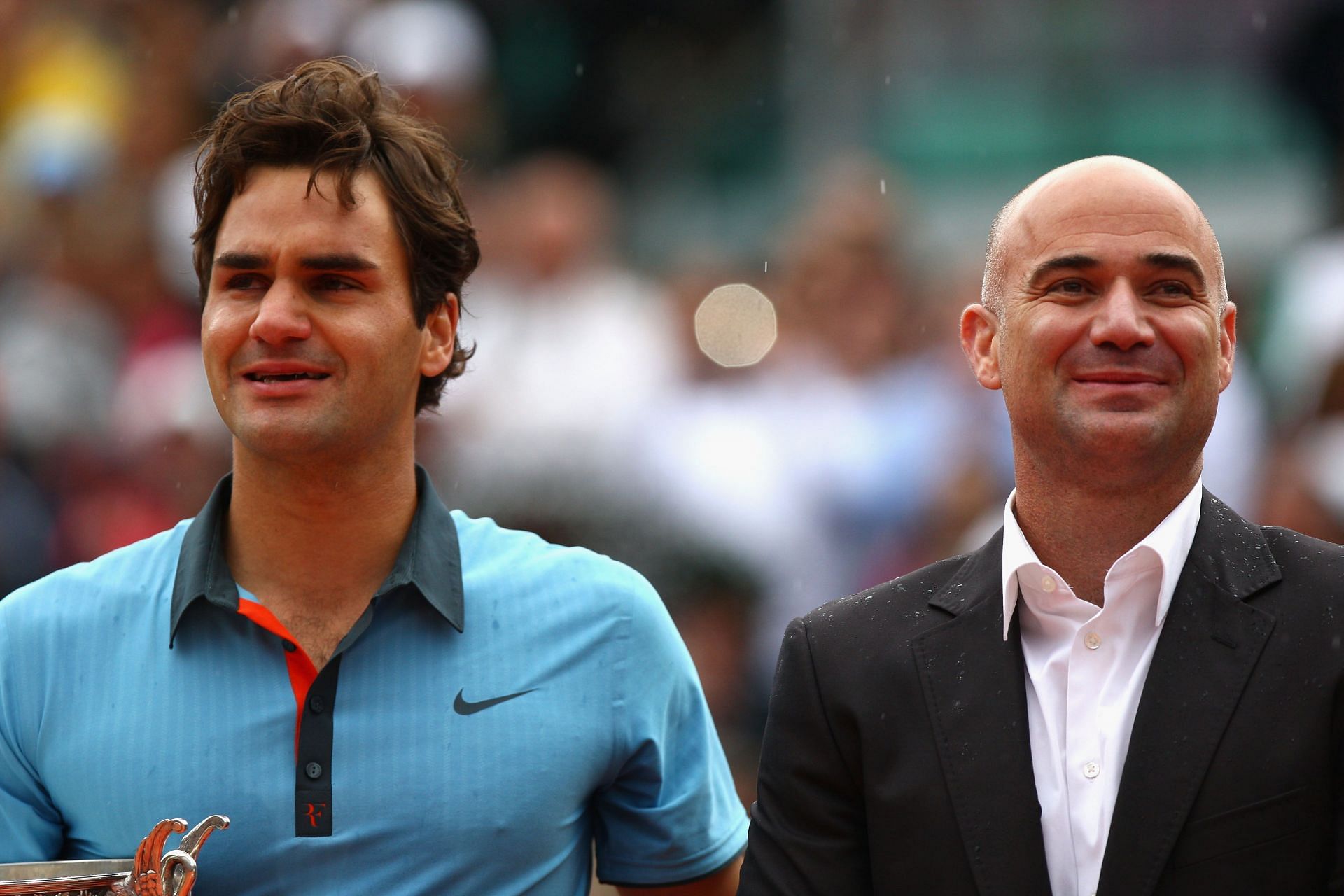 Roger Federer with Andre Agassi during the 2009 French Open