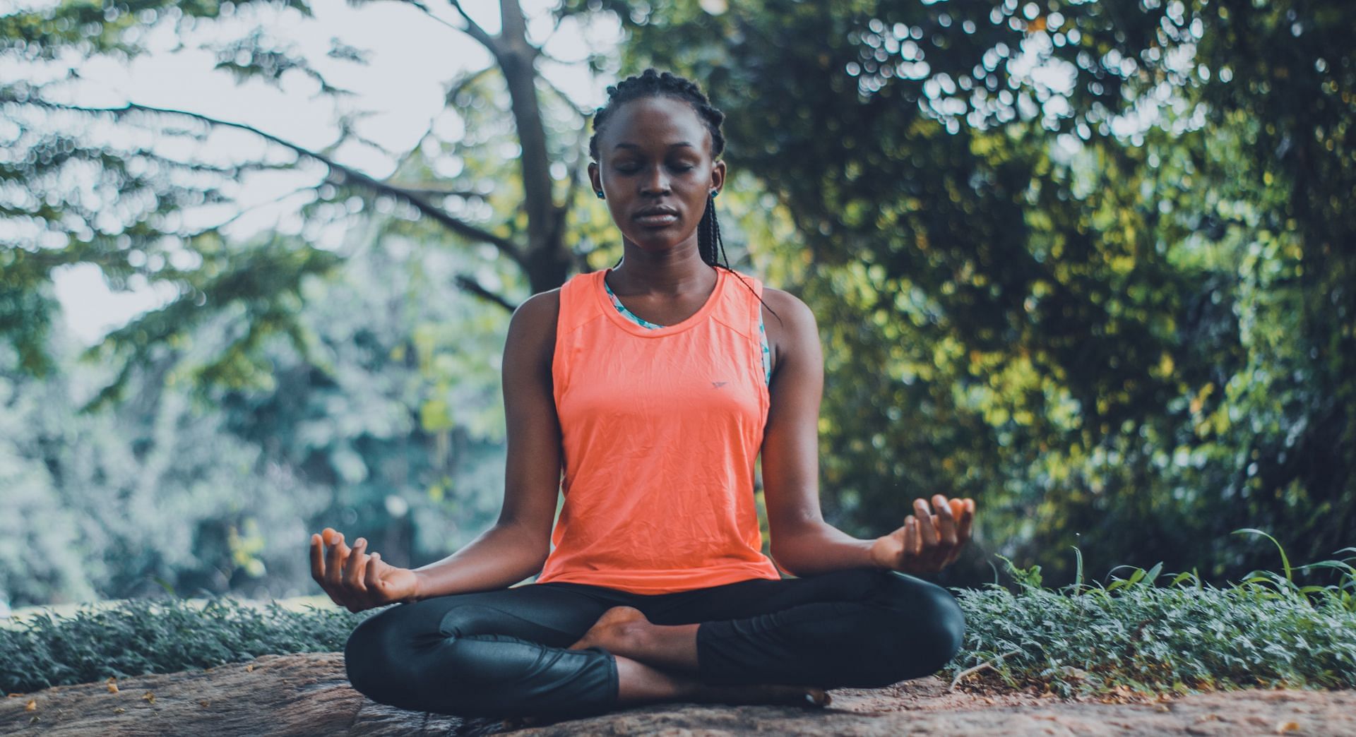 Performing yoga exercises before meditation can help relieve muscle tension (Image via Pexels @Oluremi Adebayo)