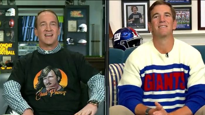 Eli Manning looks far from impressed as brother Peyton wins Super