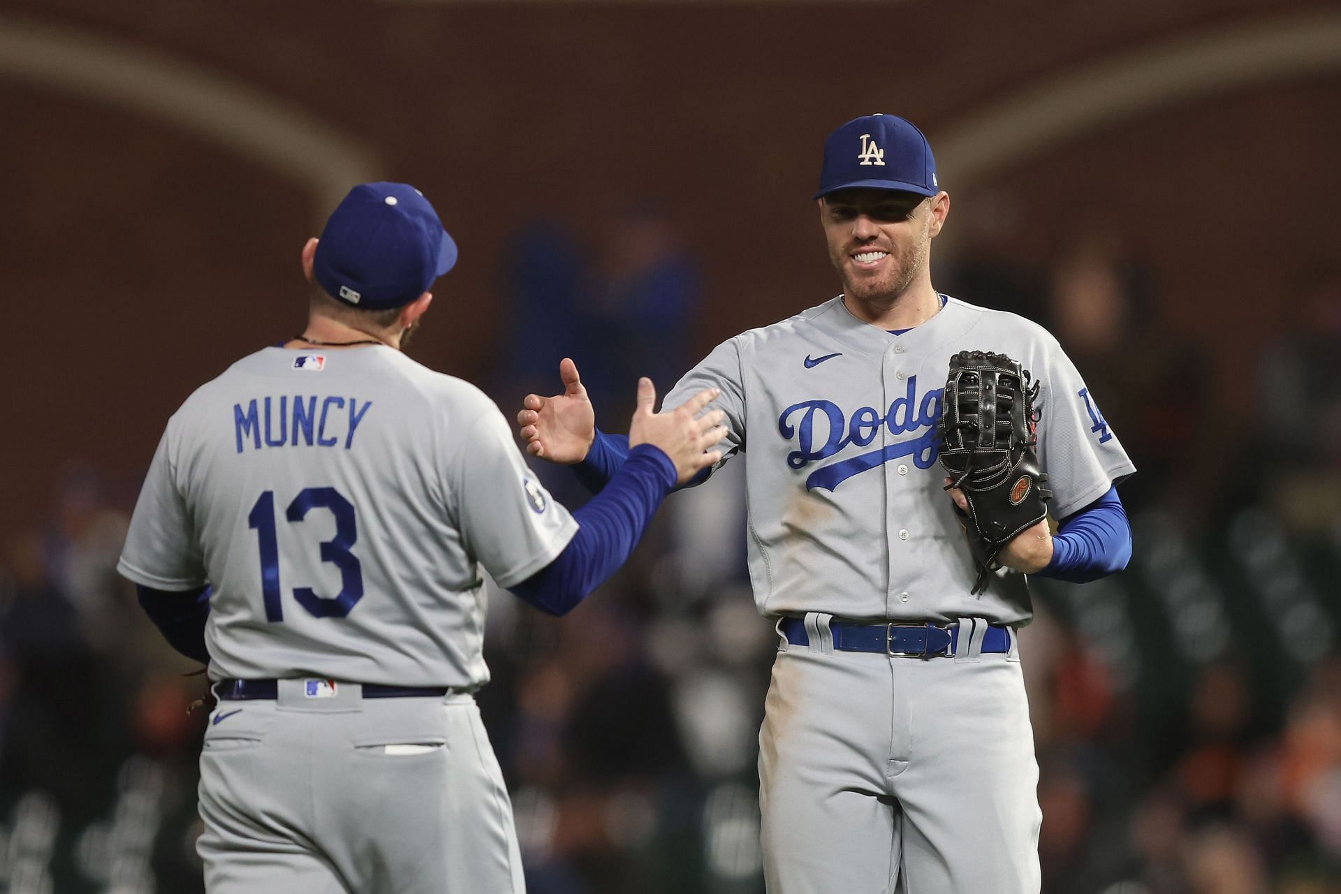 Max Muncy and Freddie Freeman of the Los Angeles Dodgers celebrate after a win against the San Francisco Giants