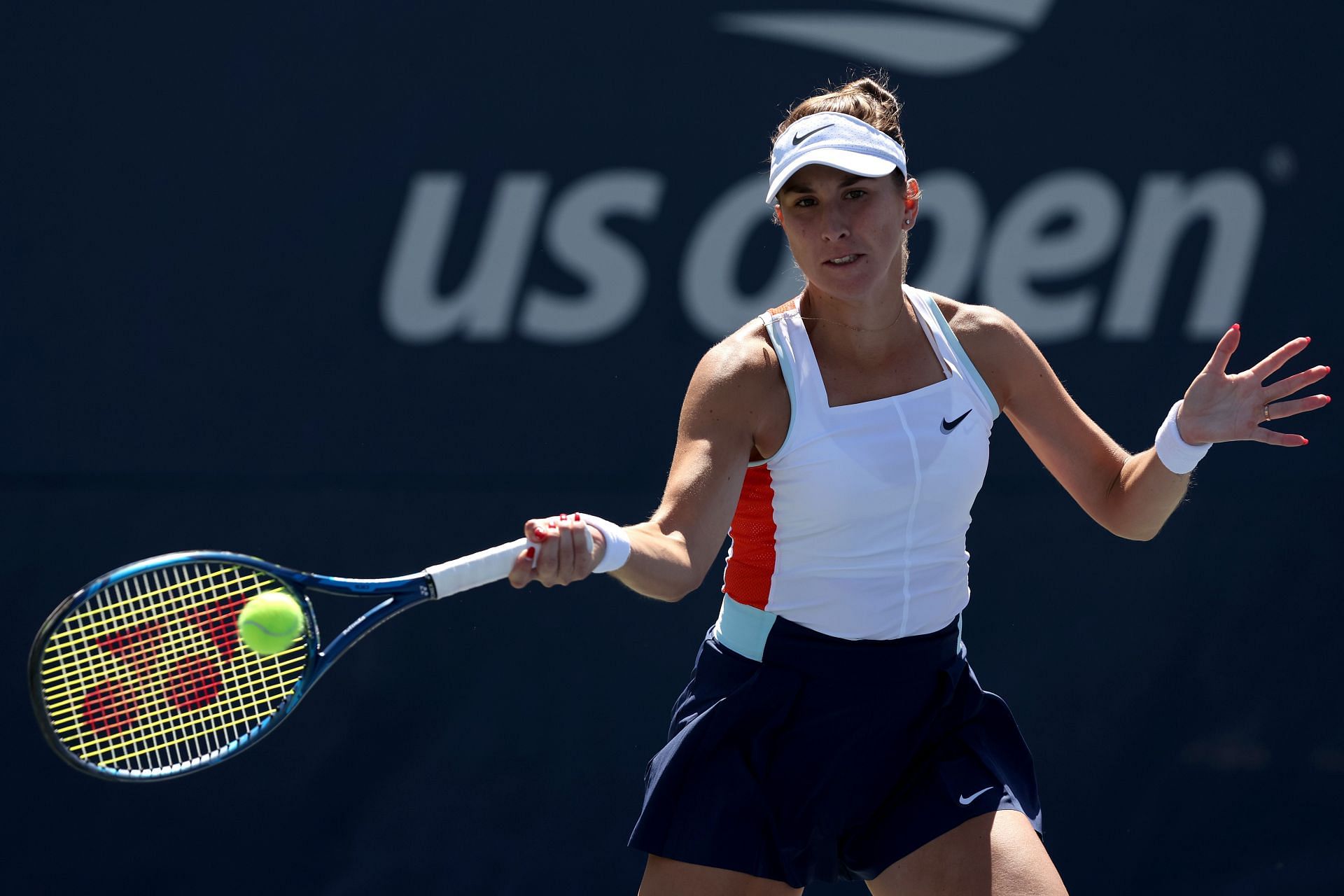 Bencic returns a shot against Sorana Cirstea at the 2022 US Open - Day 4