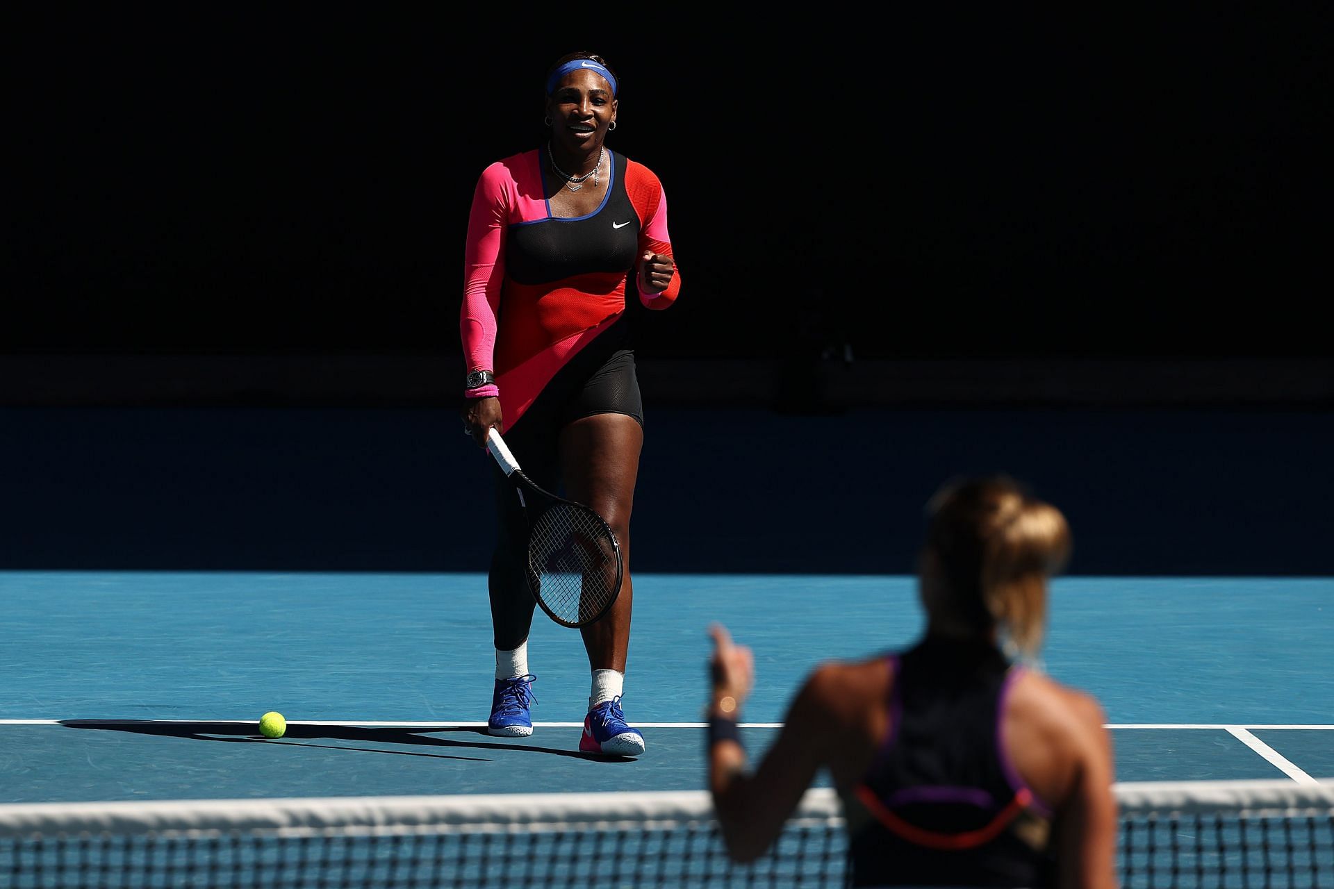 Serena Williams approaches Aryna Sabalenka at the net after winning their fourth-round match at last year&#039;s Australian Open.