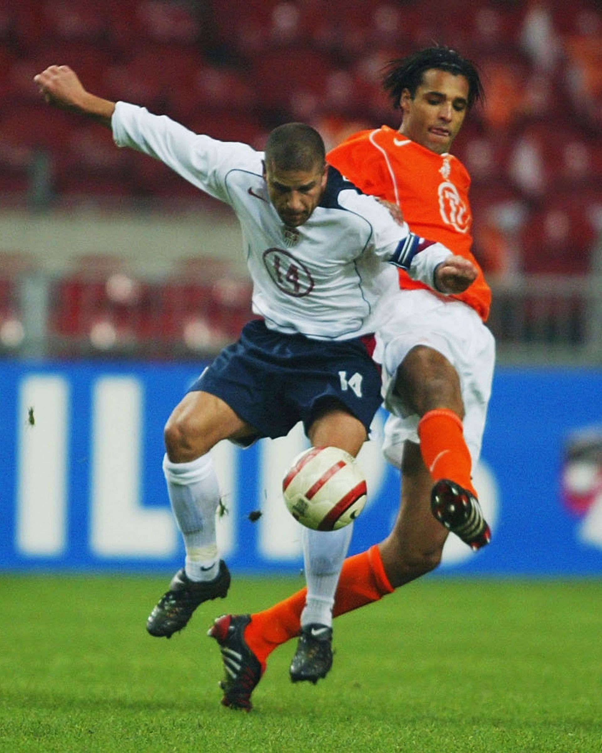 Chris Armas of the USA battles with Pierre Van Hooijdonk of Holland during the International Friendly match between Holland and USA at The Amsterdam Arena on February 18, 2004.