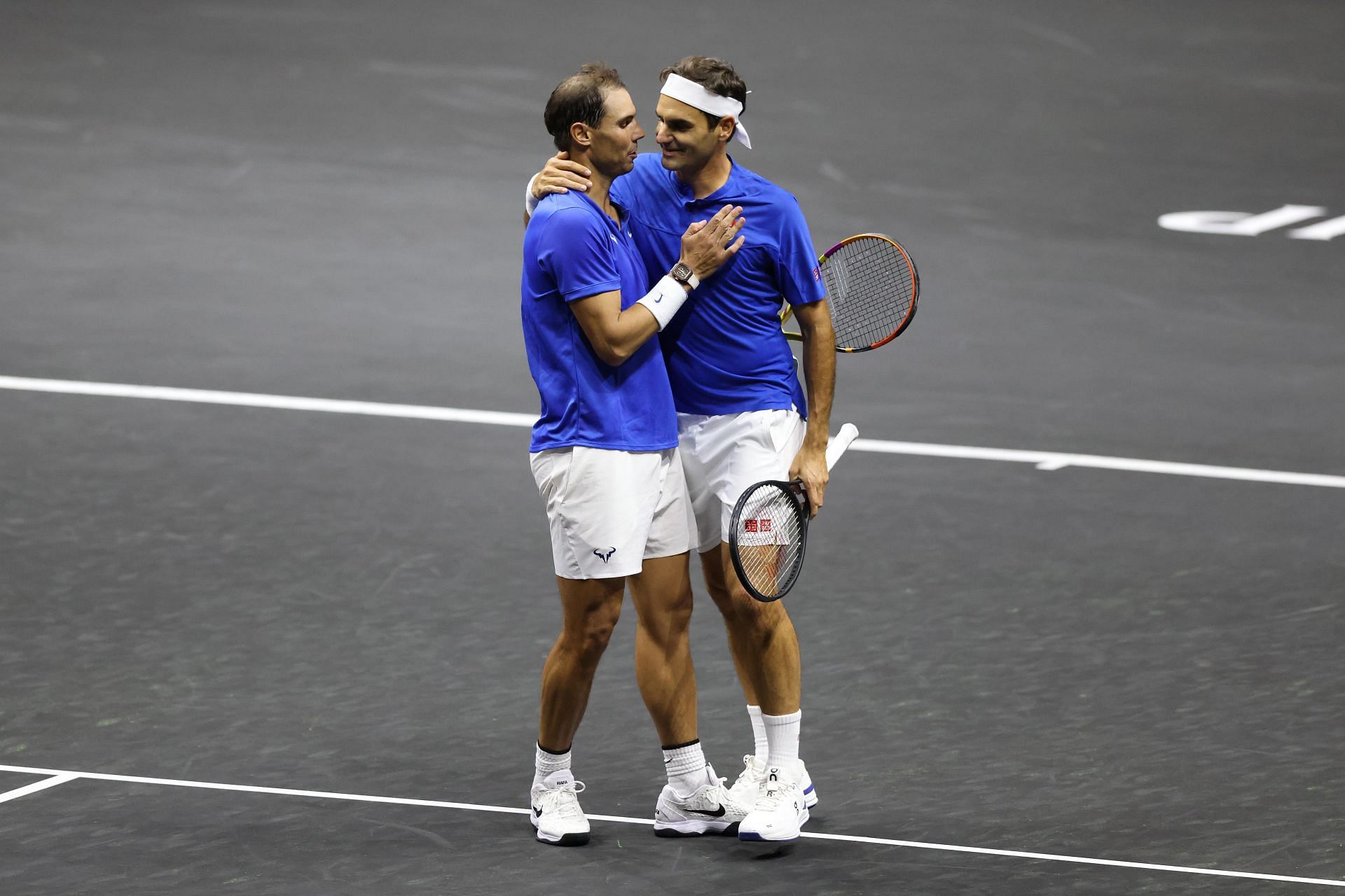 Roger Federer (right) and Rafael Nadal embraces at the net after losing a closing match.