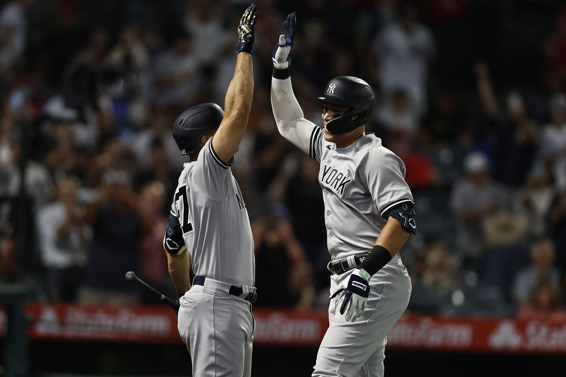 Aaron Judge celebrates his 50th home run of the season with Giancarlo Stanton at Angel Stadium of Anaheim.