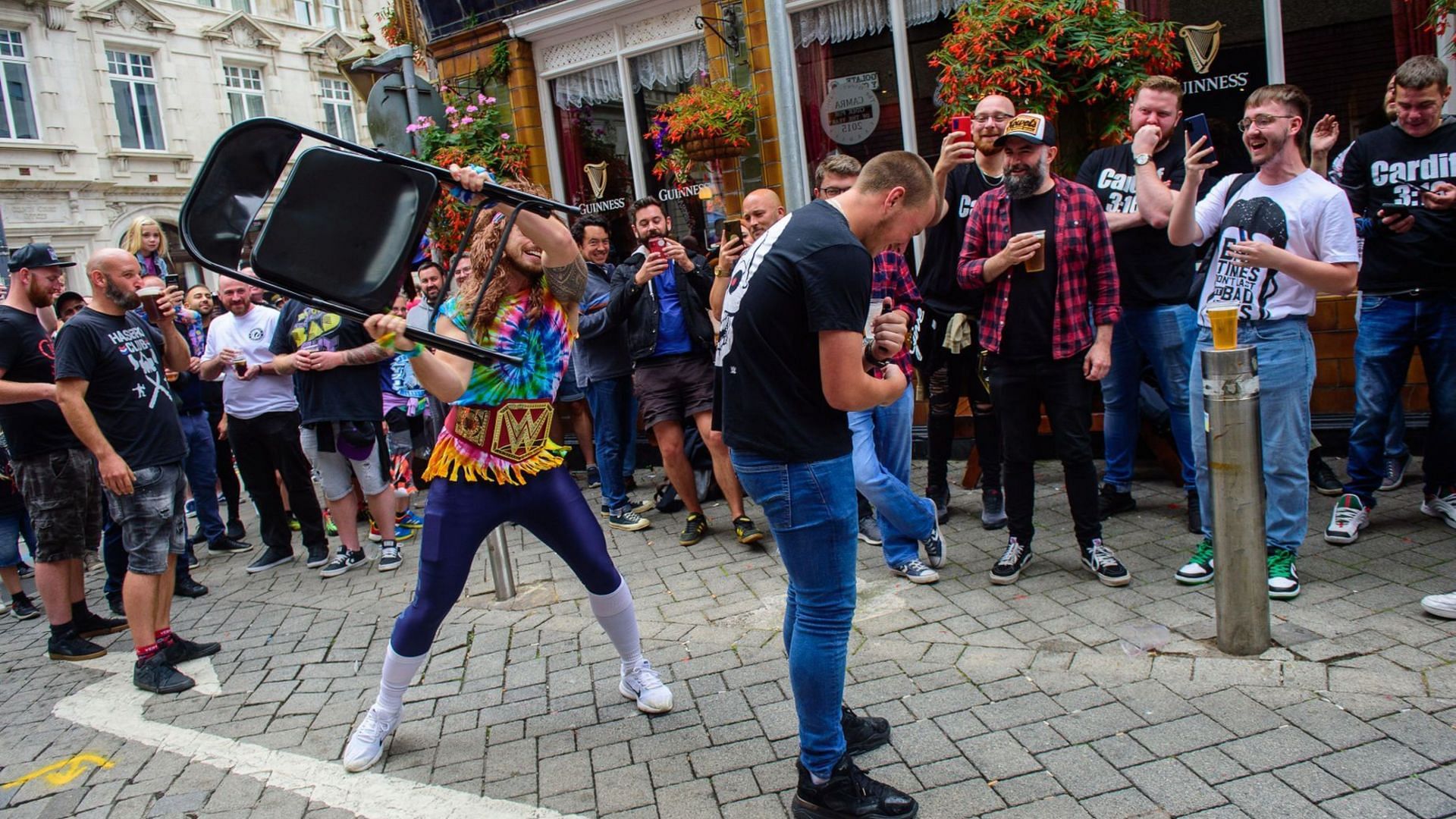 A fan hitting another with a chair outside the Principality Stadium