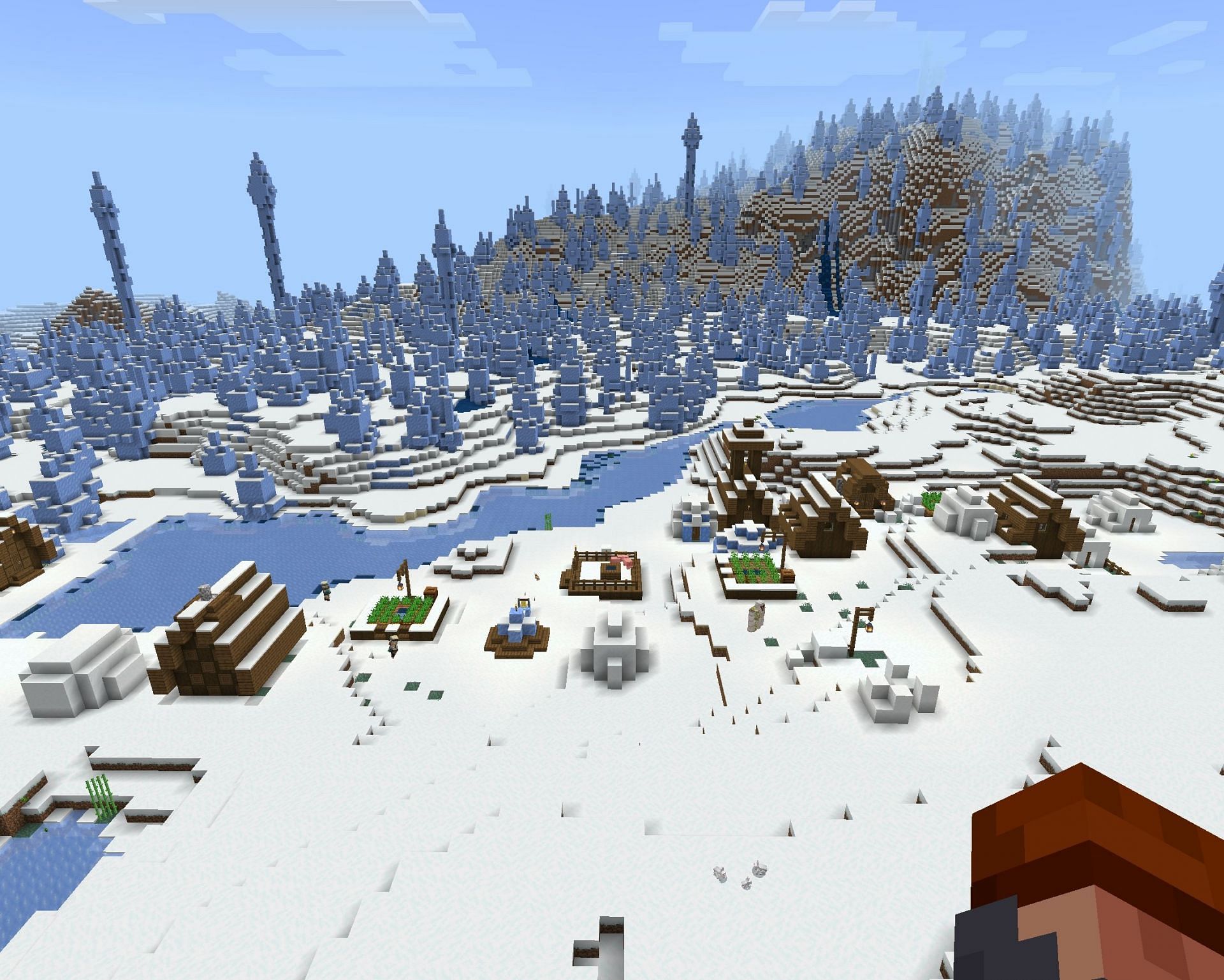 A snowy plains village right next to an ice spikes biome (Image via Minecraft)