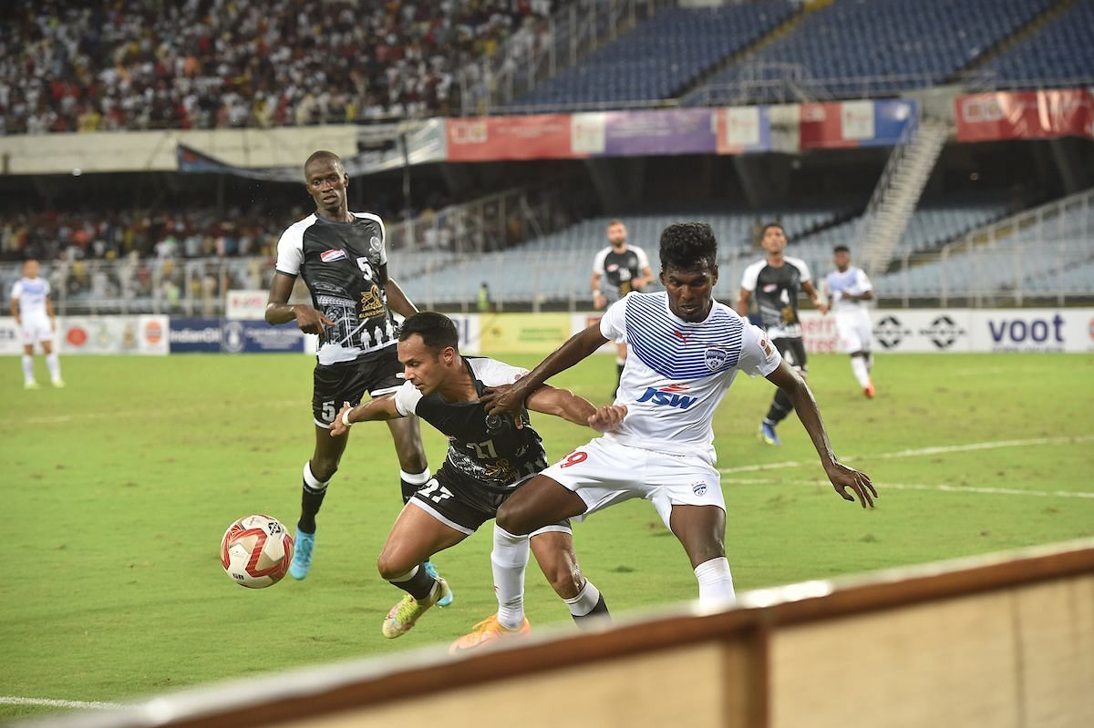 Mohammedan SC Abhishek Ambekar guards the ball from Bengaluru FC