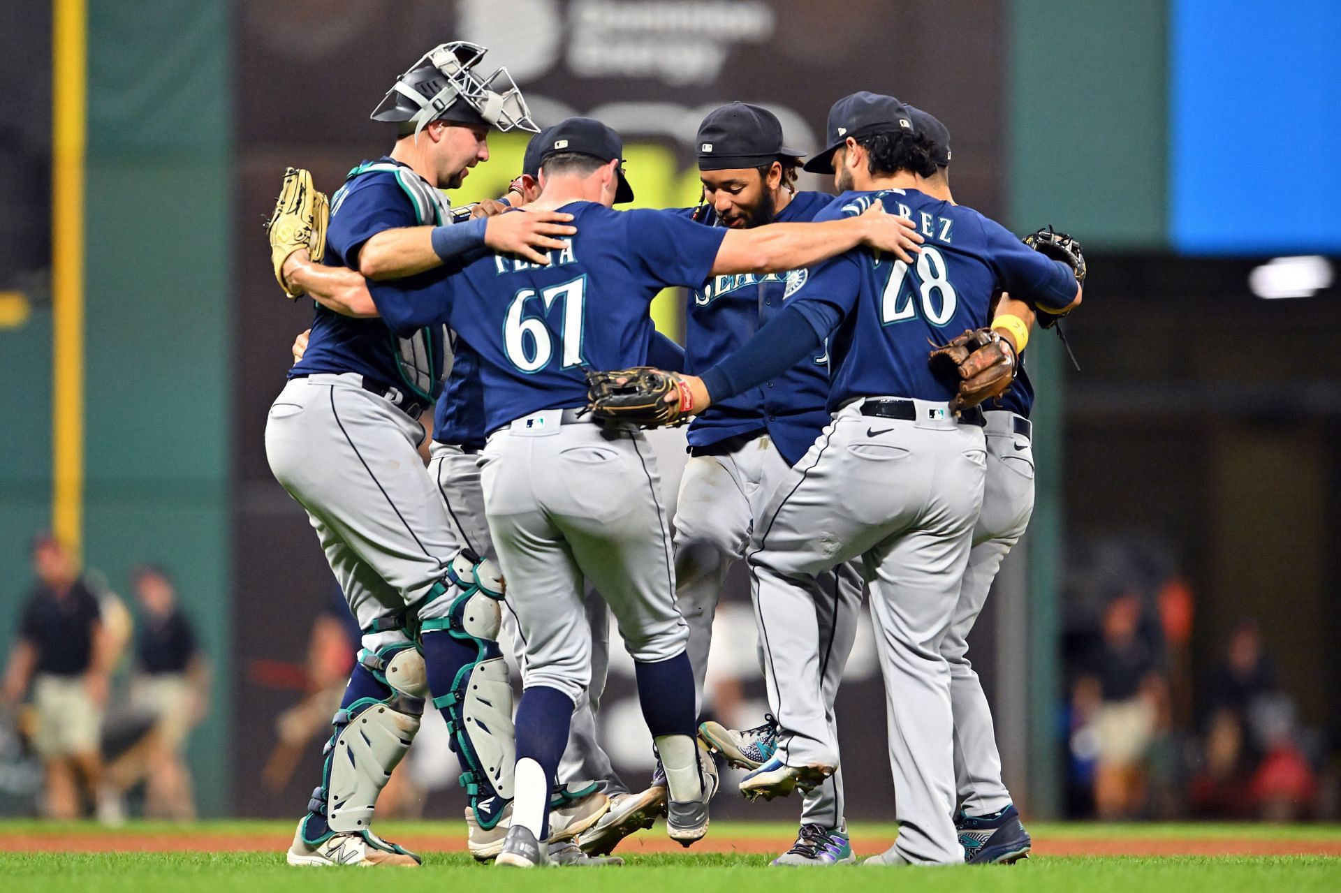Seattle Mariners congregate for a postgame victory celebration.