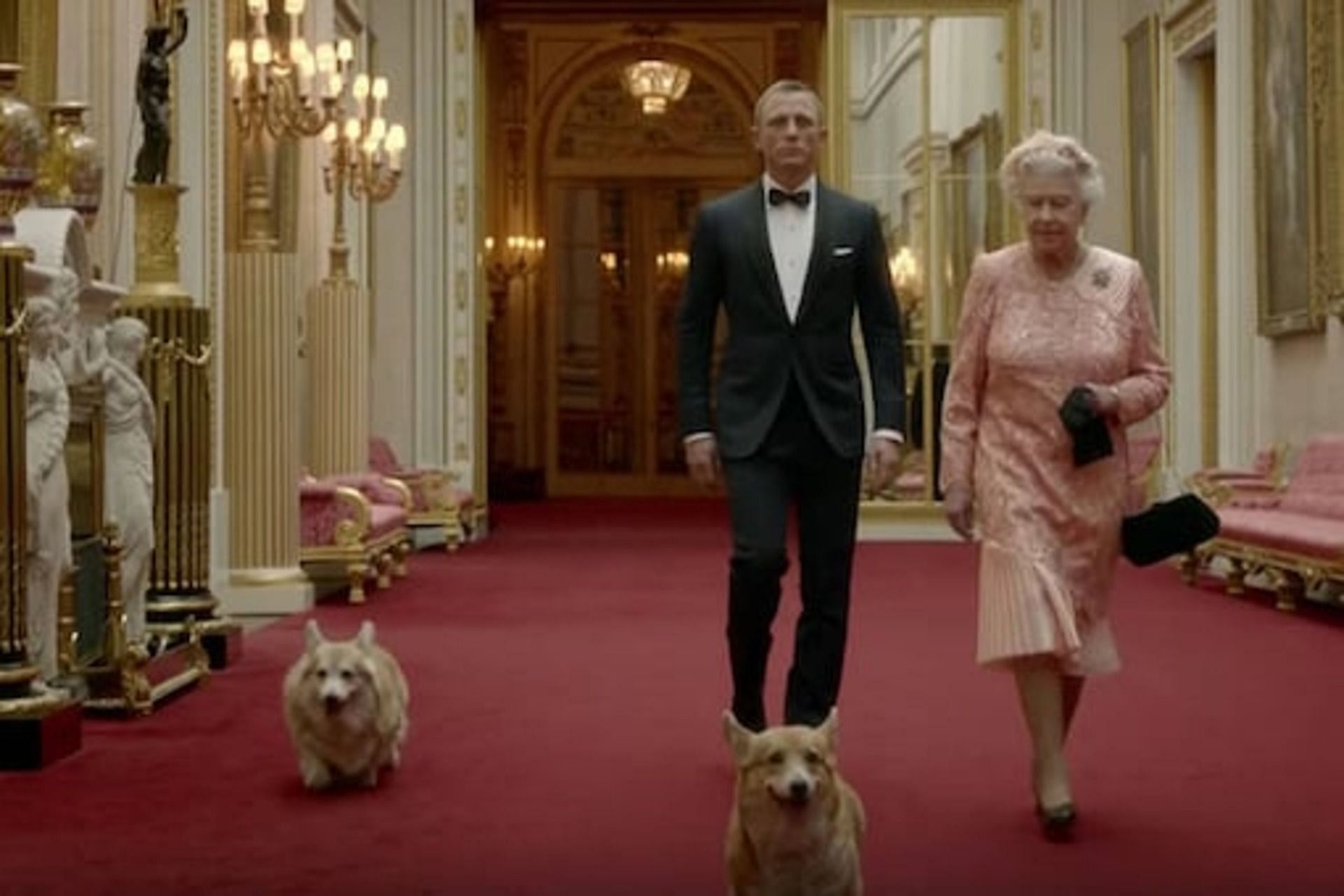 Queen Elizabeth with her corgis in the video for the 2012 London Olympics. (Image via Twitter)