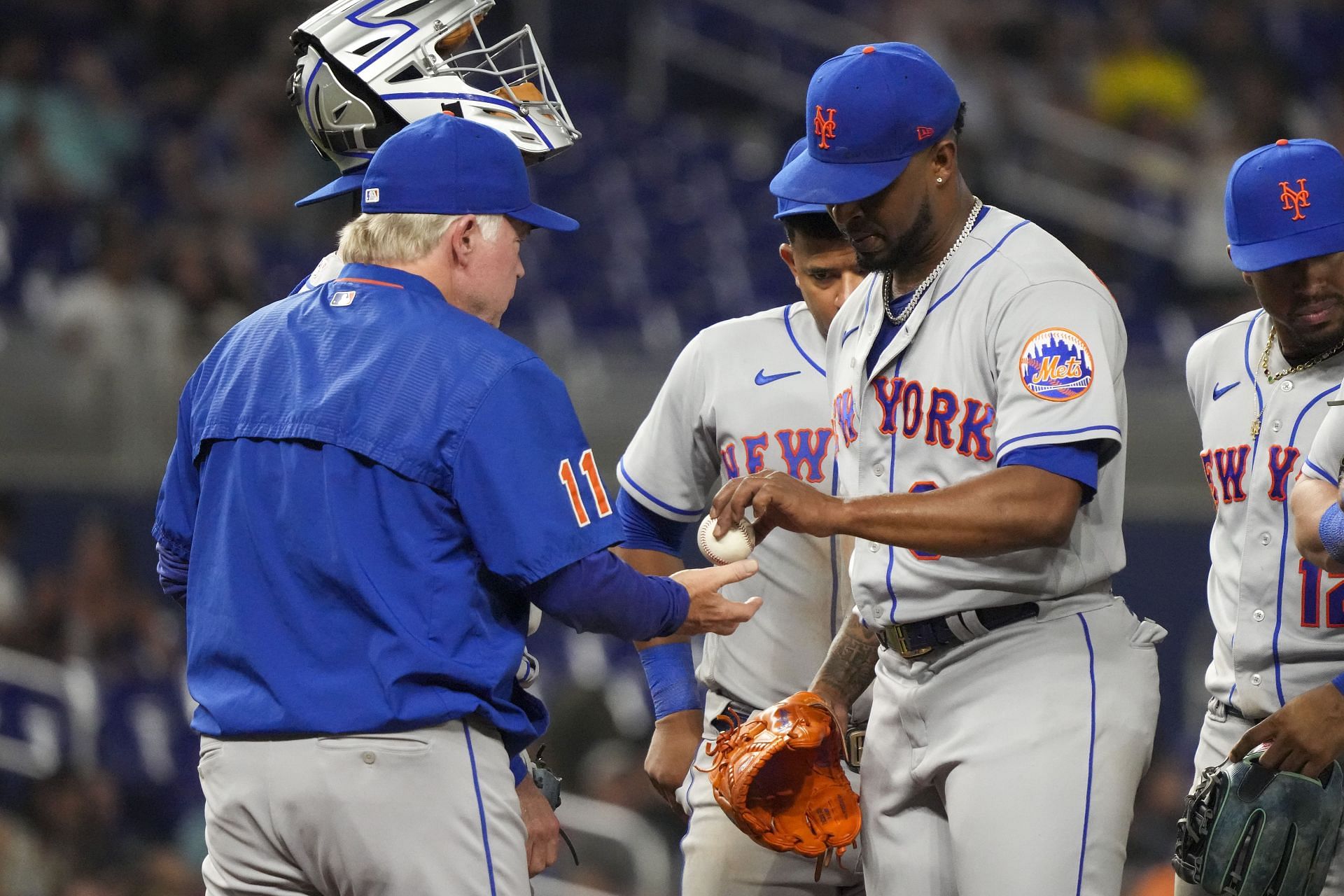 Manager Buck Showalter takes the baseball from Joely Rodriguez in the eighth inning against the Miami Marlins