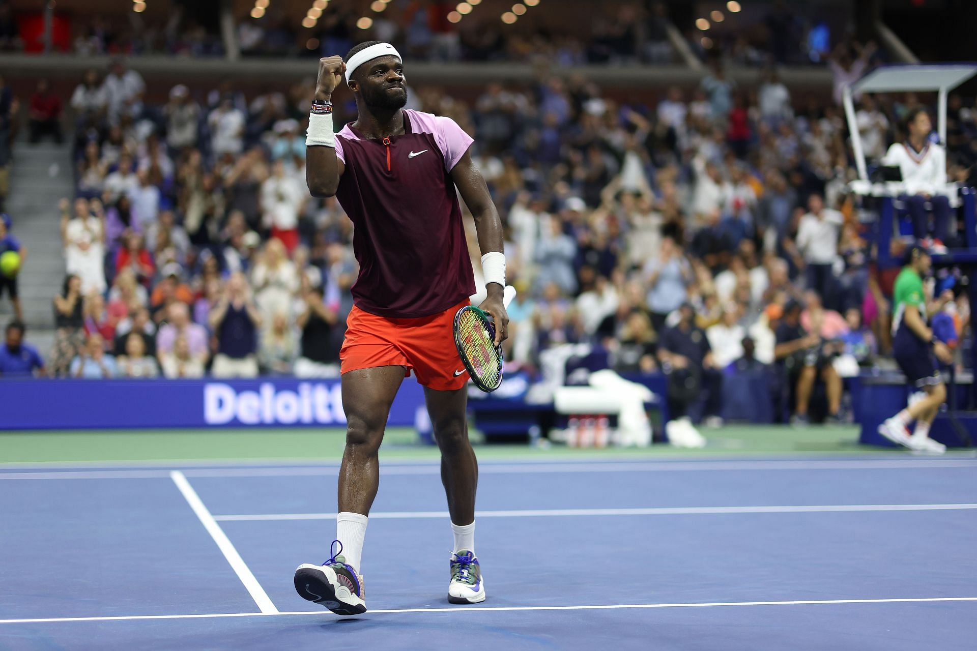 Frances Tiafoe celebrates winning a game against Carlos Alcaraz at the 2022 US Open