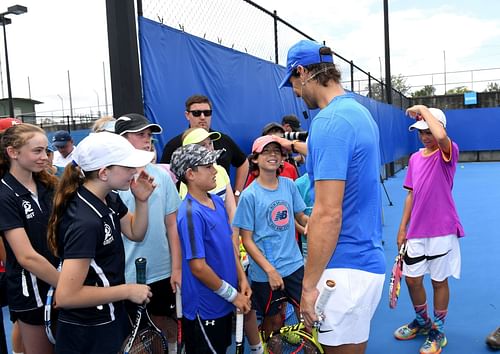 Rafael Nadal interacts with young players. Photo by Bradley Kanaris/Getty Images