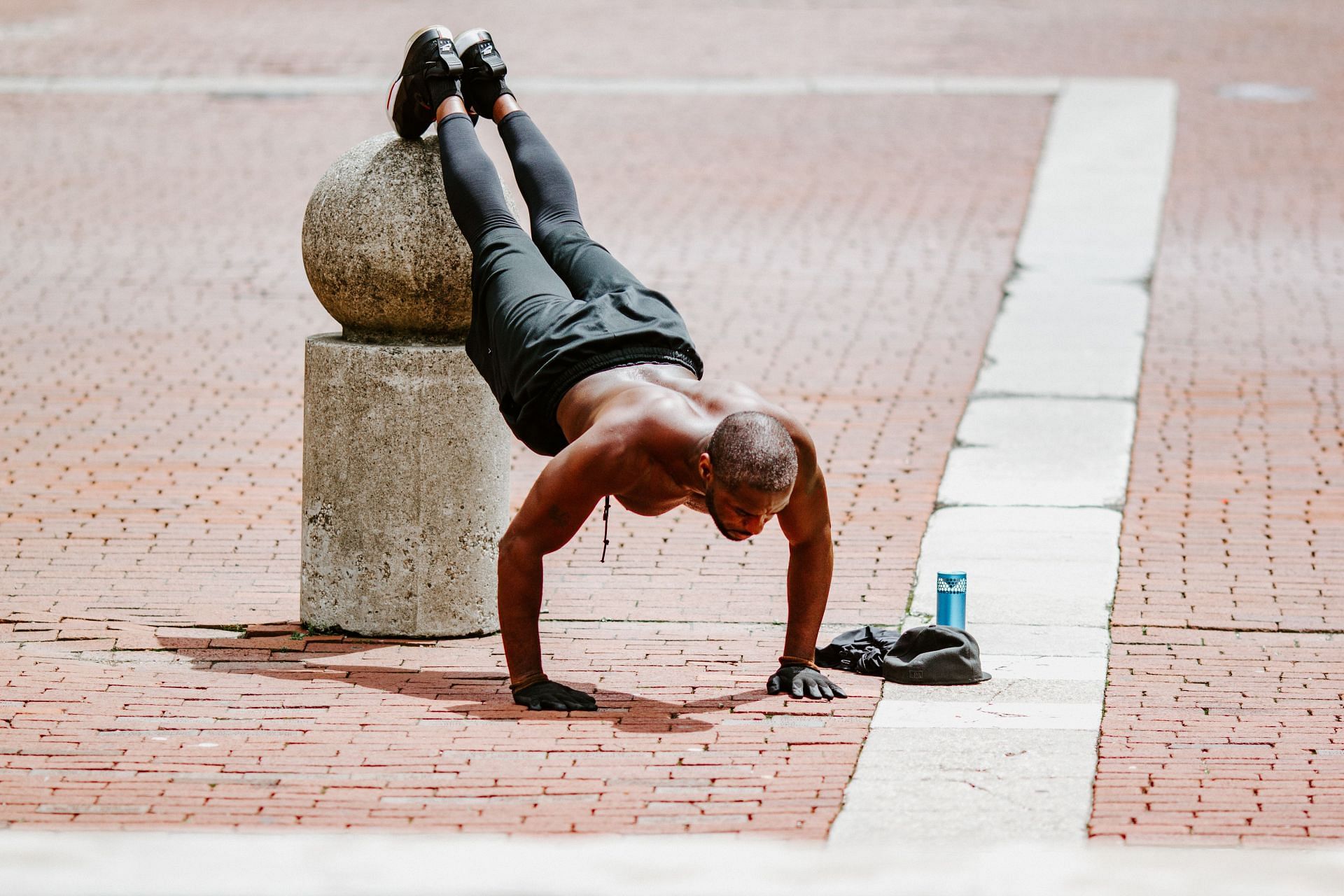 Bodyweight shoulder exercises are a great way to build muscles and strengthen them. (Image via Unsplash /Gabe Pierce)