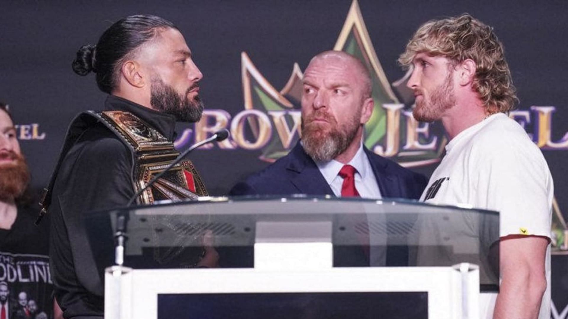 Roman Reigns and Logan Paul facing-off at the Crown Jewel press conference in Las Vegas