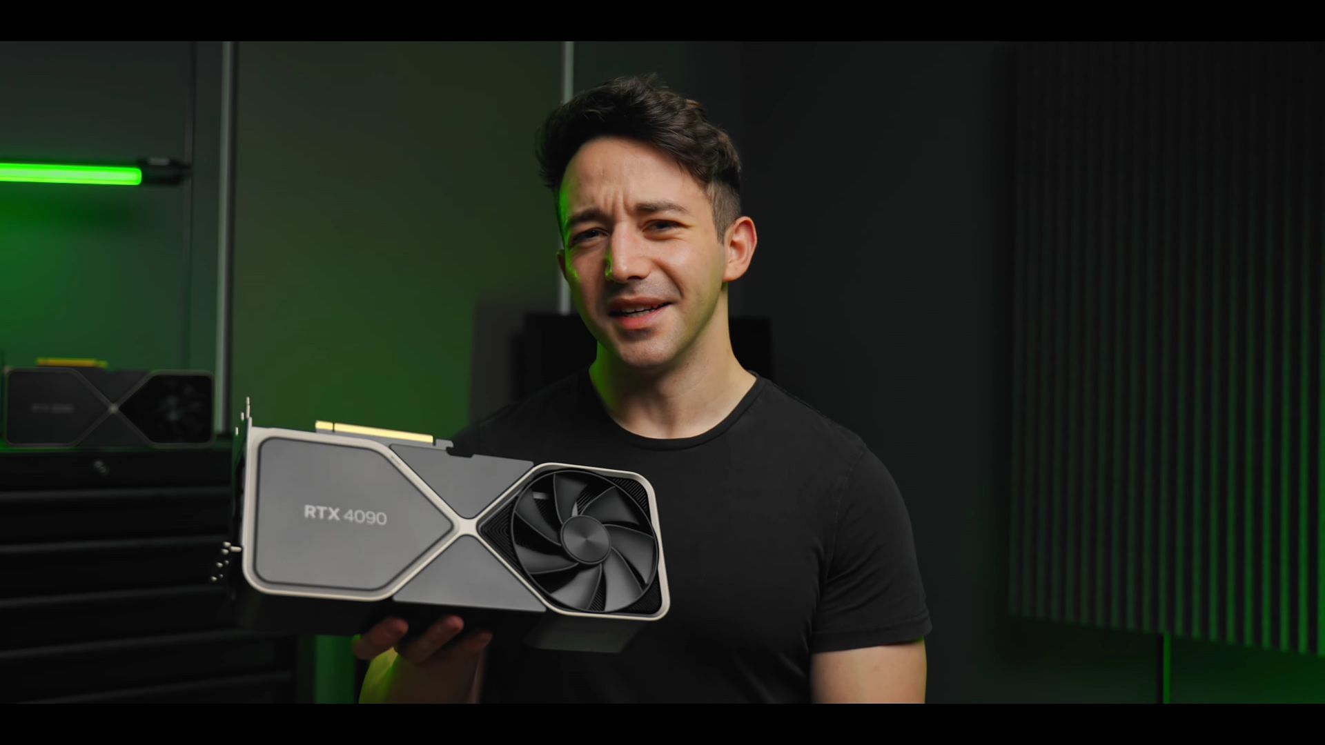 The RTX 4090 Founders Edition is a massive card on hand (Image via Optimum Tech/YouTube)
